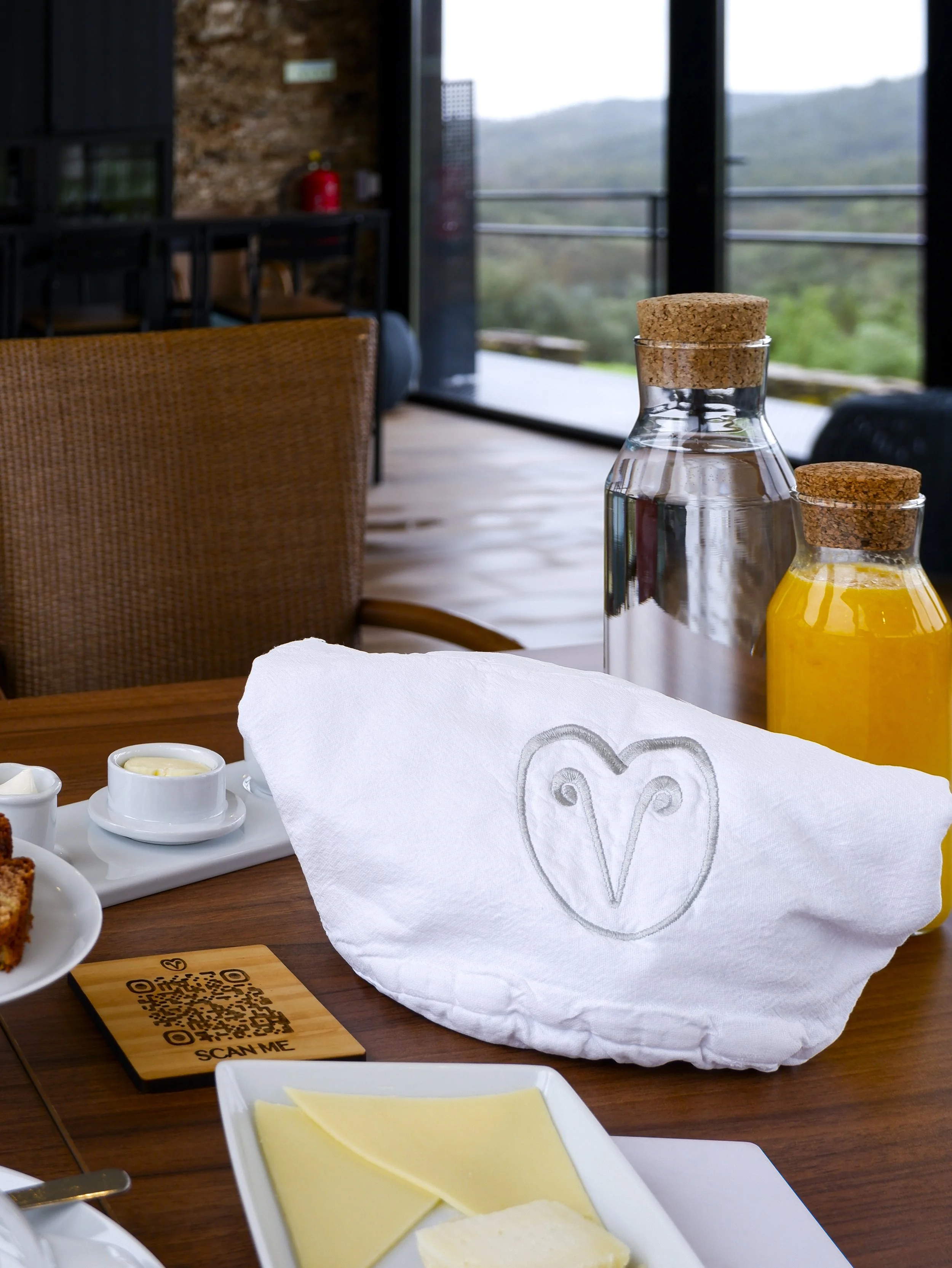 Local breakfast with fresh juice, artisan cheeses, and regional products overlooking the Alentejo countryside
