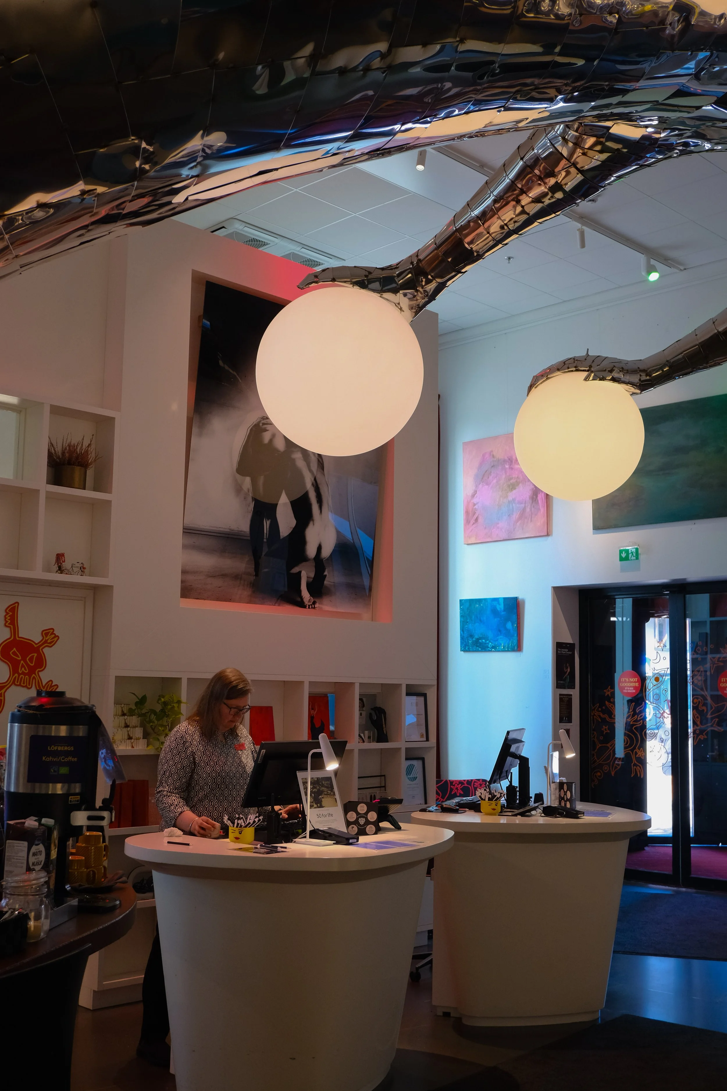 Art-inspired reception area with sculptural lighting and contemporary installations