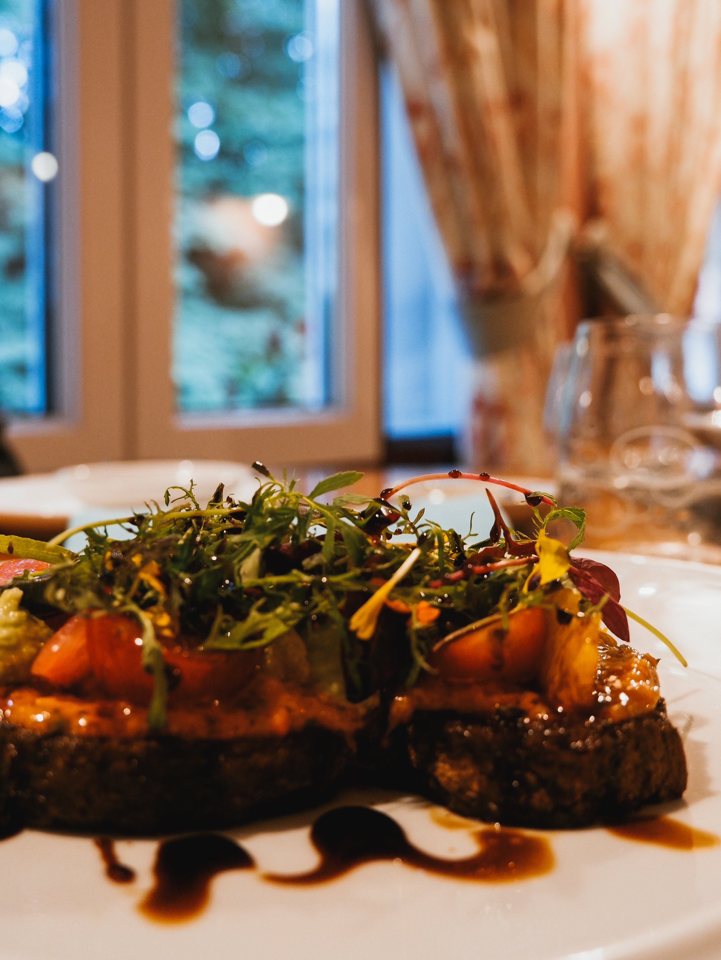Seasonal gourmet dish showcasing fresh local ingredients served in the resort restaurant
