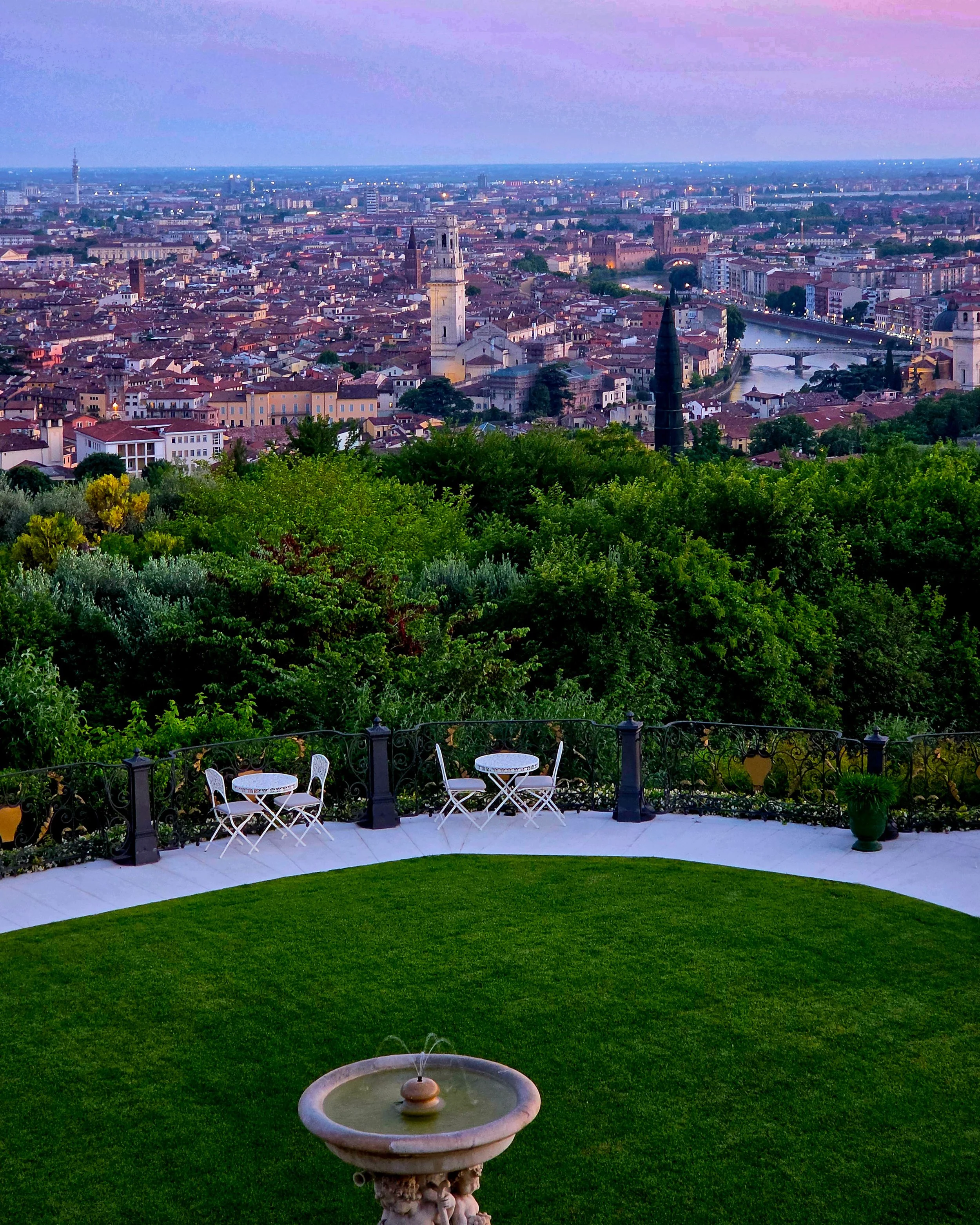 Panoramic sunset view over the historic skyline of Verona from the gardens of Relais Fra’ Lorenzo