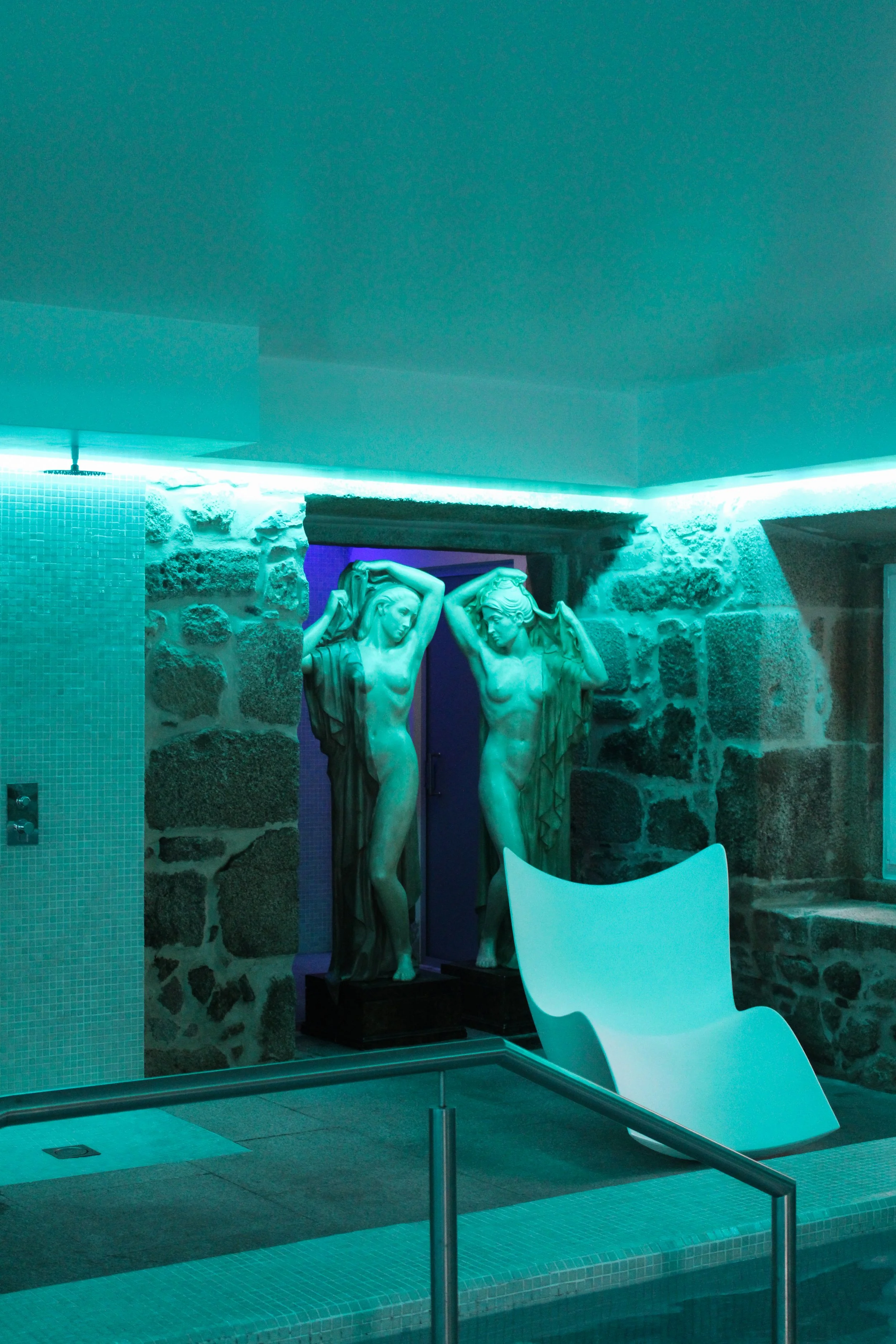 Serene indoor spa featuring hydrotherapy pool, wellness facilities, and ambient lighting