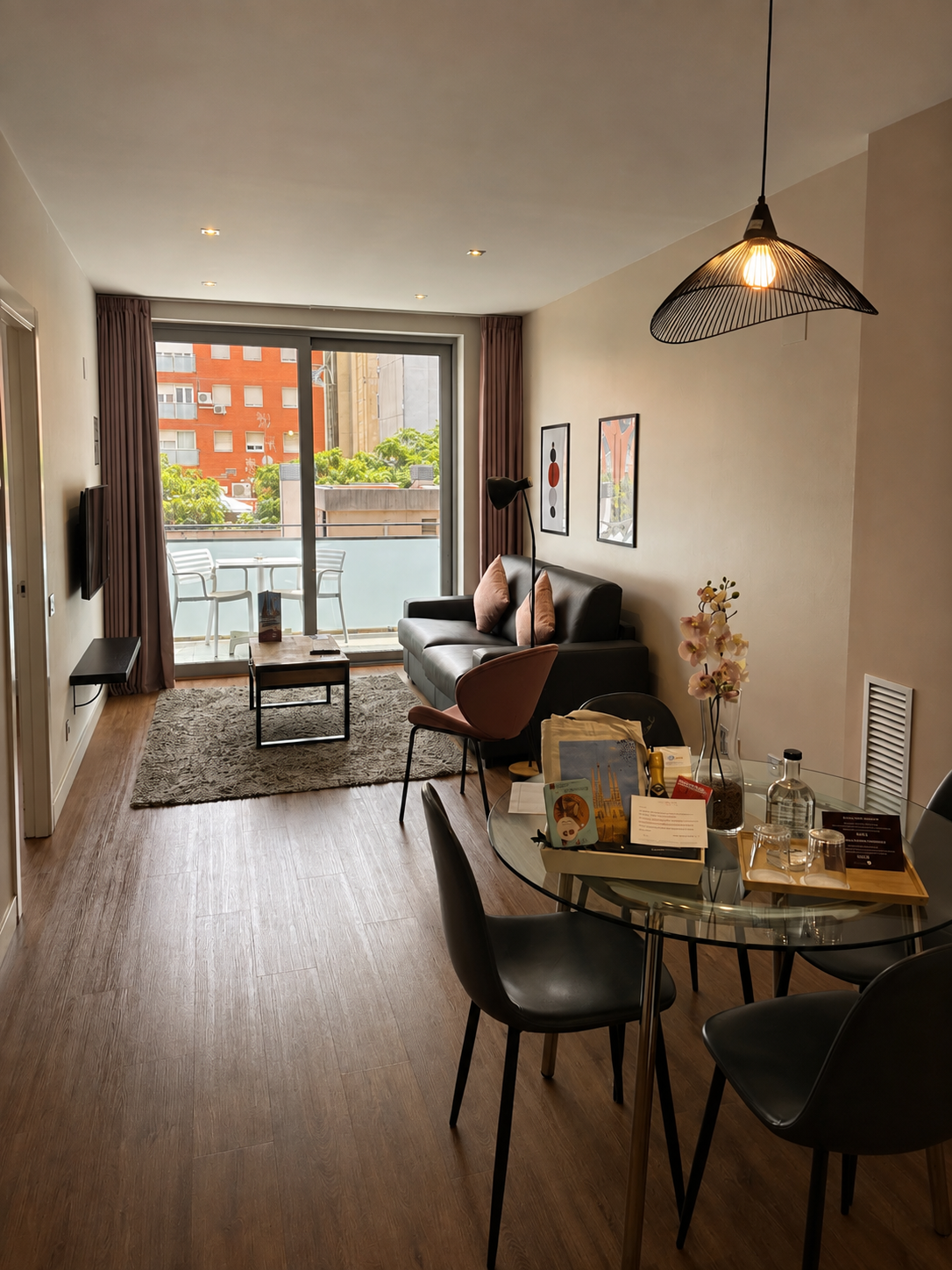 Spacious apartment living area with dining space and private balcony