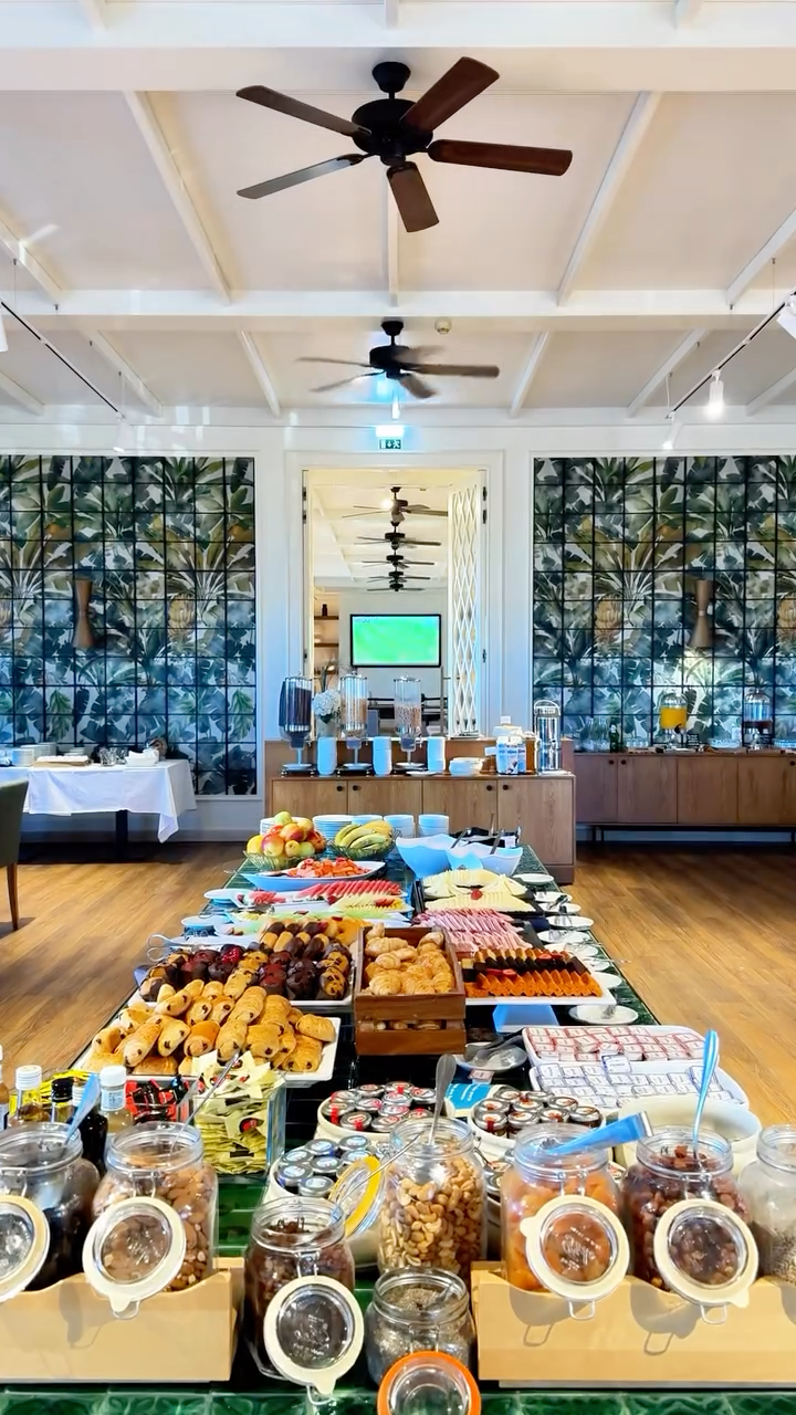 Breakfast buffet featuring fresh pastries, fruit, and local specialties at Amendoeira Golf Resort