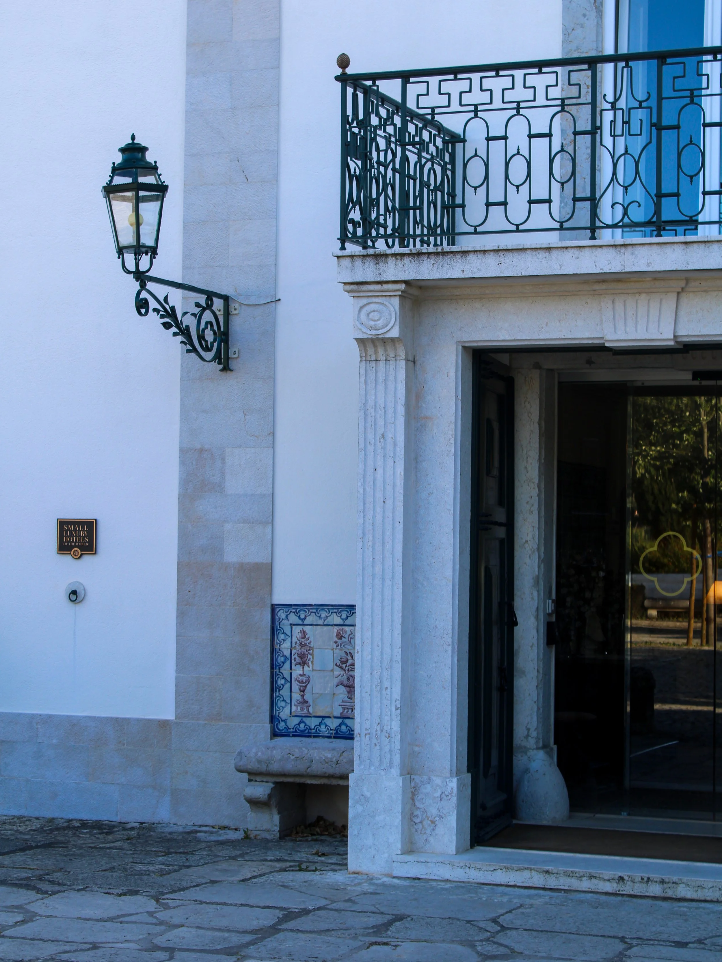Historic entrance of the Small Luxury Hotels of the World property showcasing Portuguese architecture at Hotel Casa Palmela