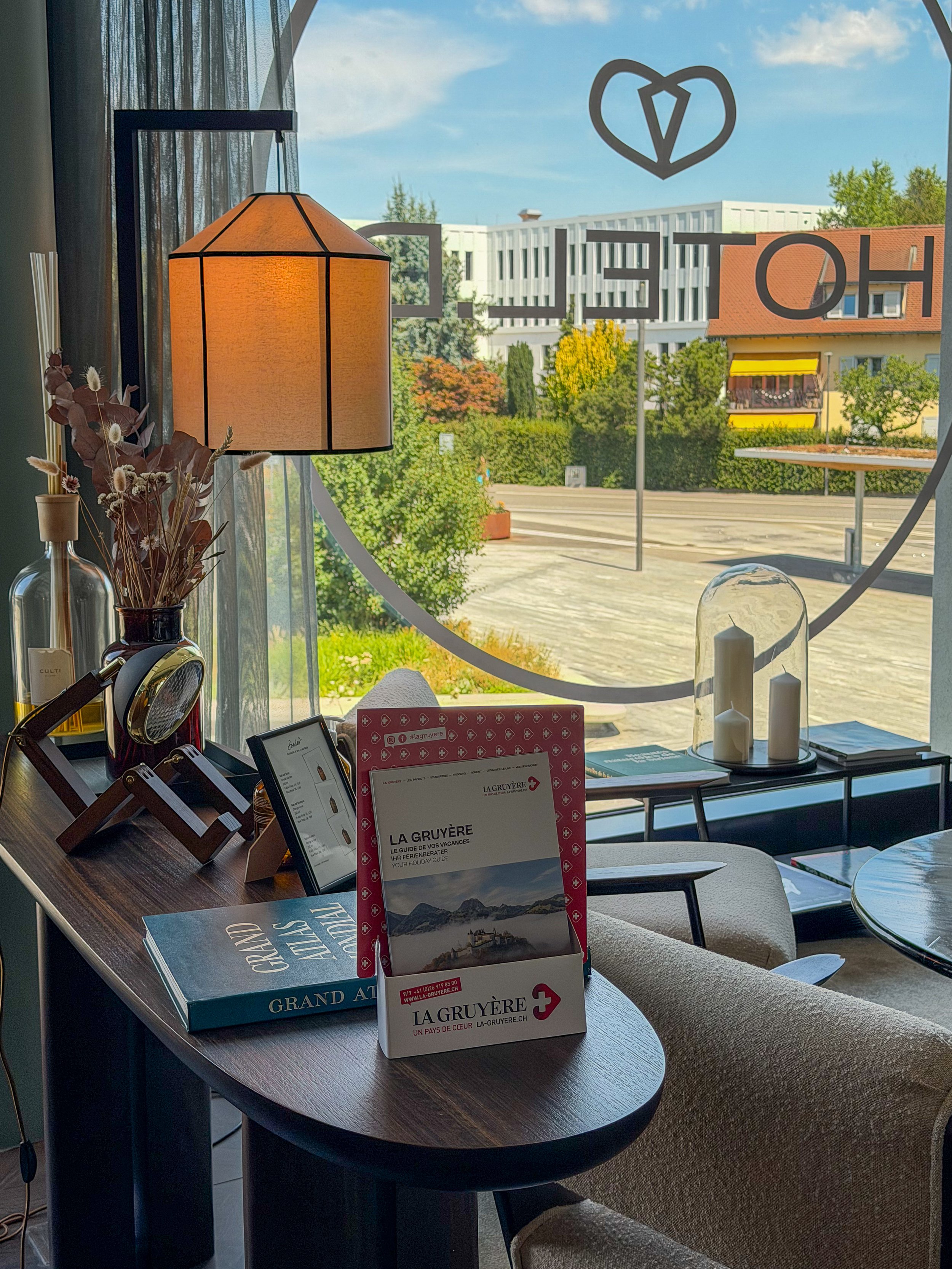Cosy reading corner overlooking the town with local guides and elegant decorative details