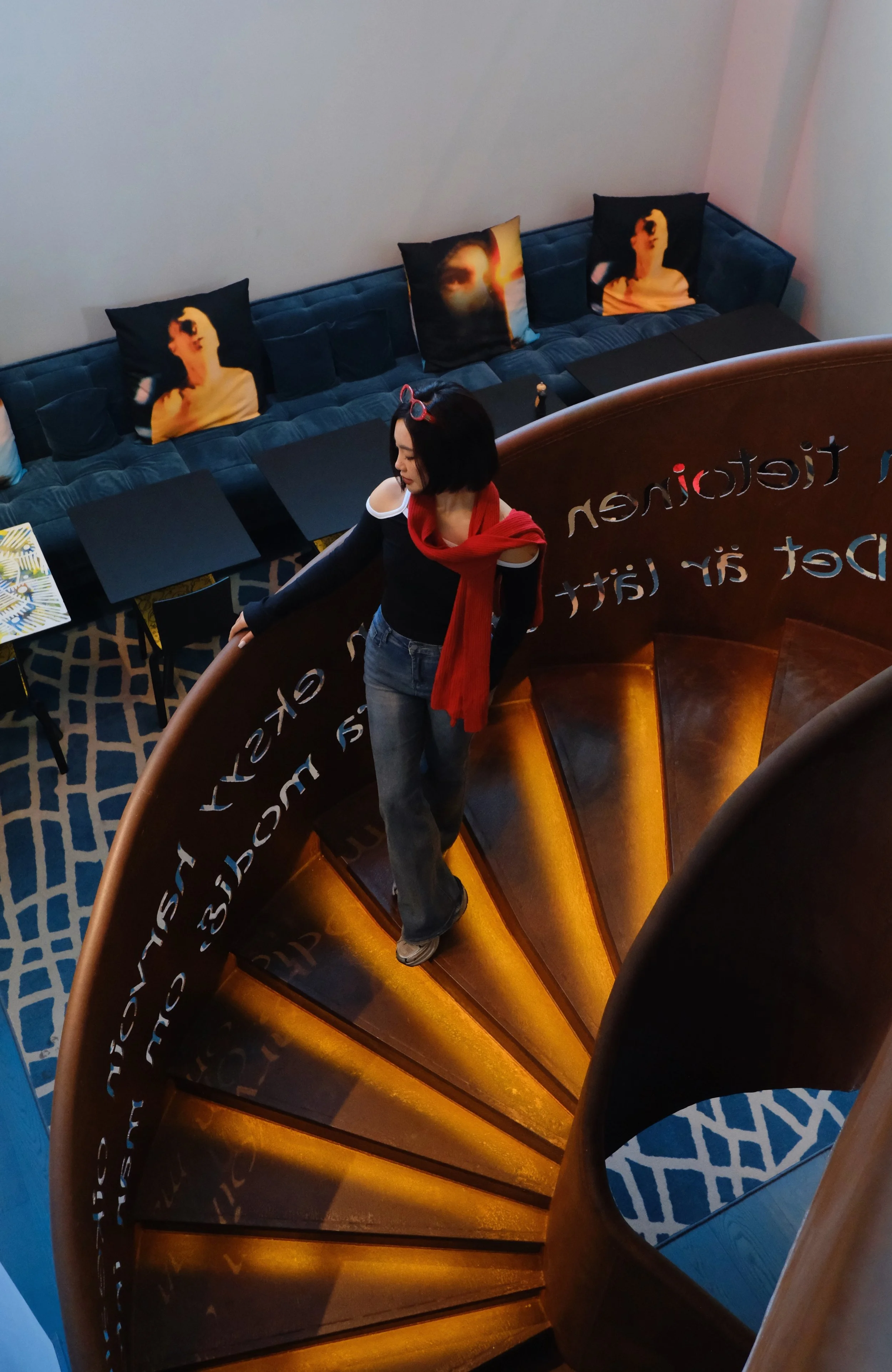 Sculptural spiral staircase overlooking the hotel's artistic social lounge