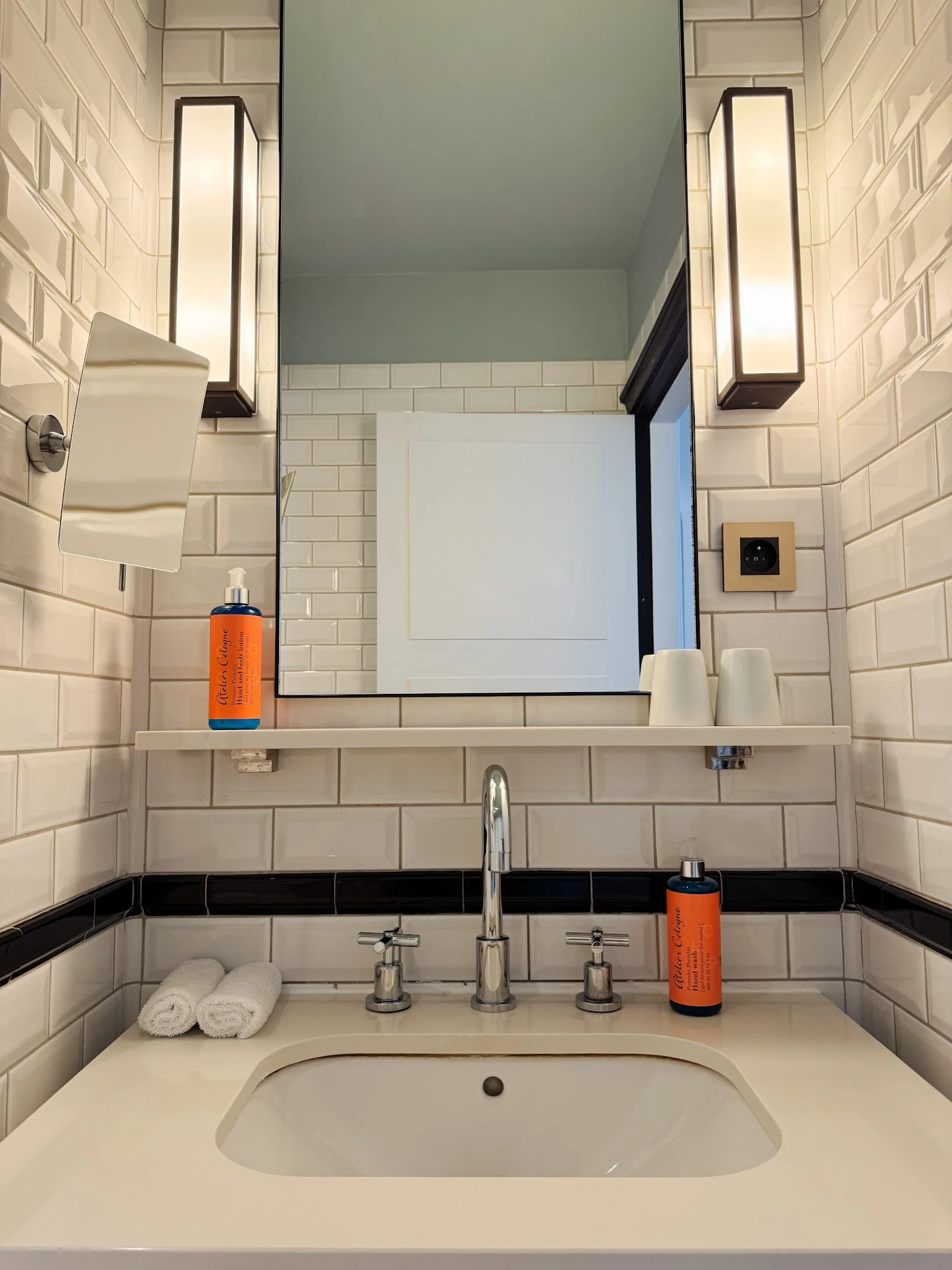 Elegant bathroom featuring marble details, modern fixtures, and premium amenities