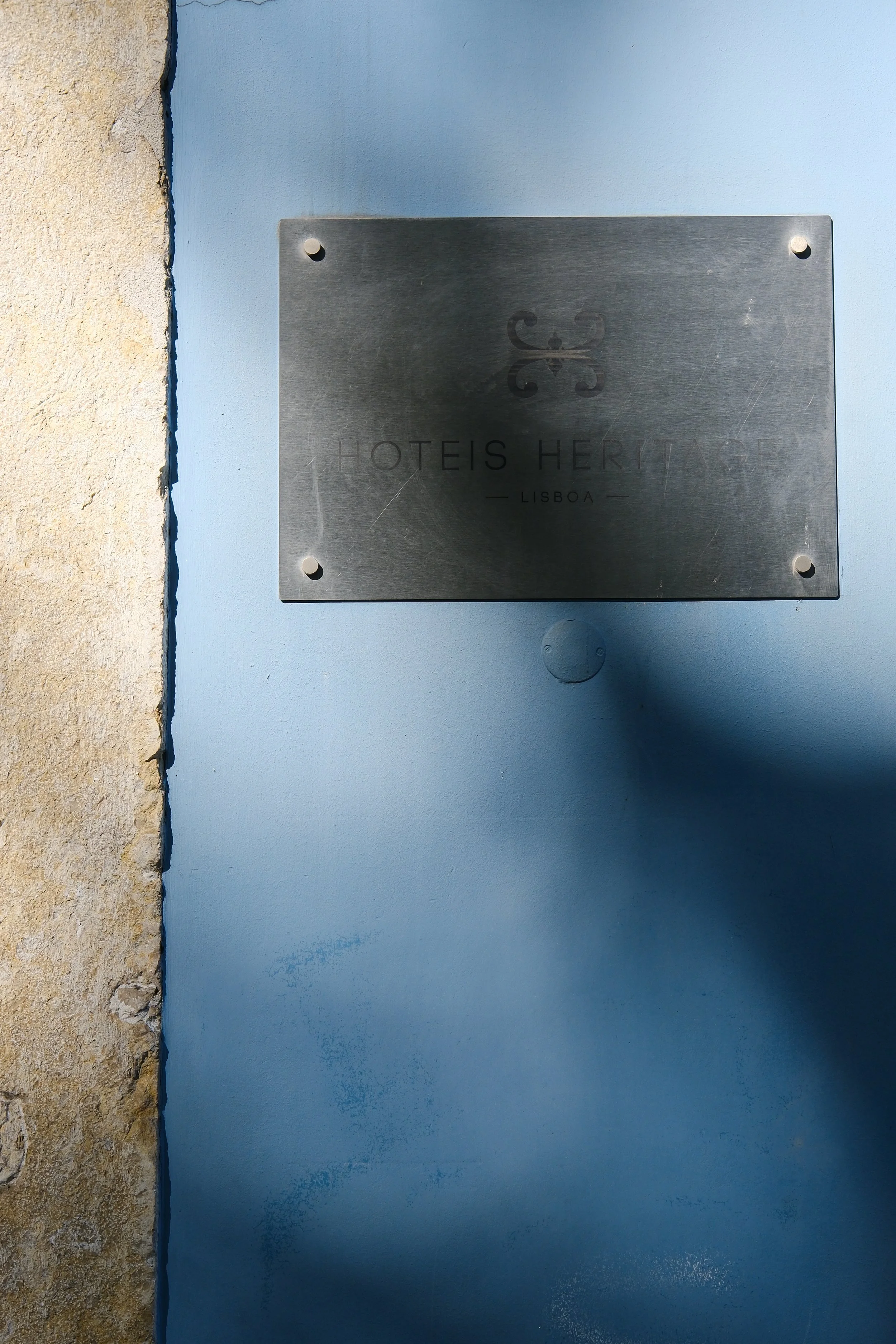 Elegant entrance plaque welcoming guests to this historic Lisbon boutique hotel