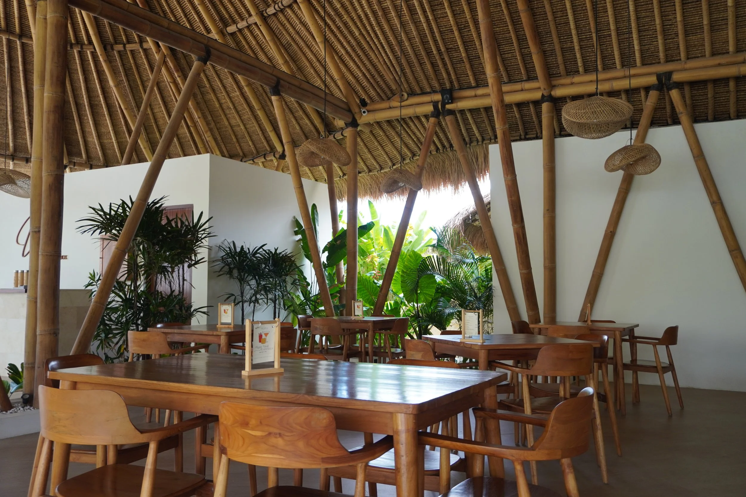 Open-air restaurant with bamboo architecture and relaxed island atmosphere
