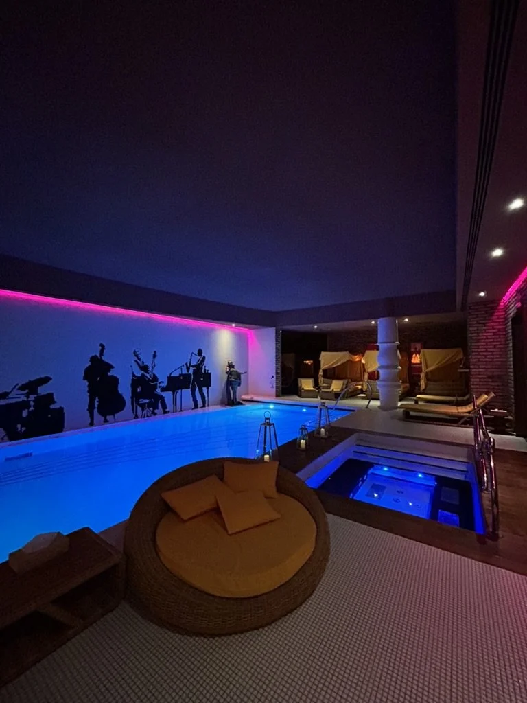 Indoor wellness pool with jacuzzi and relaxing spa atmosphere