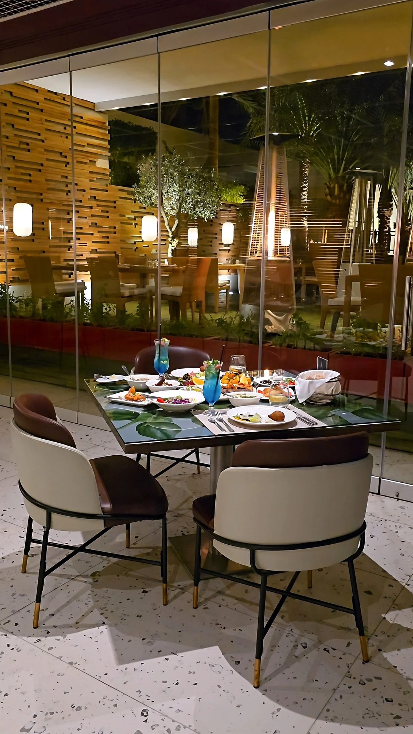 Outdoor dining experience with Mediterranean cuisine in an elegant evening setting