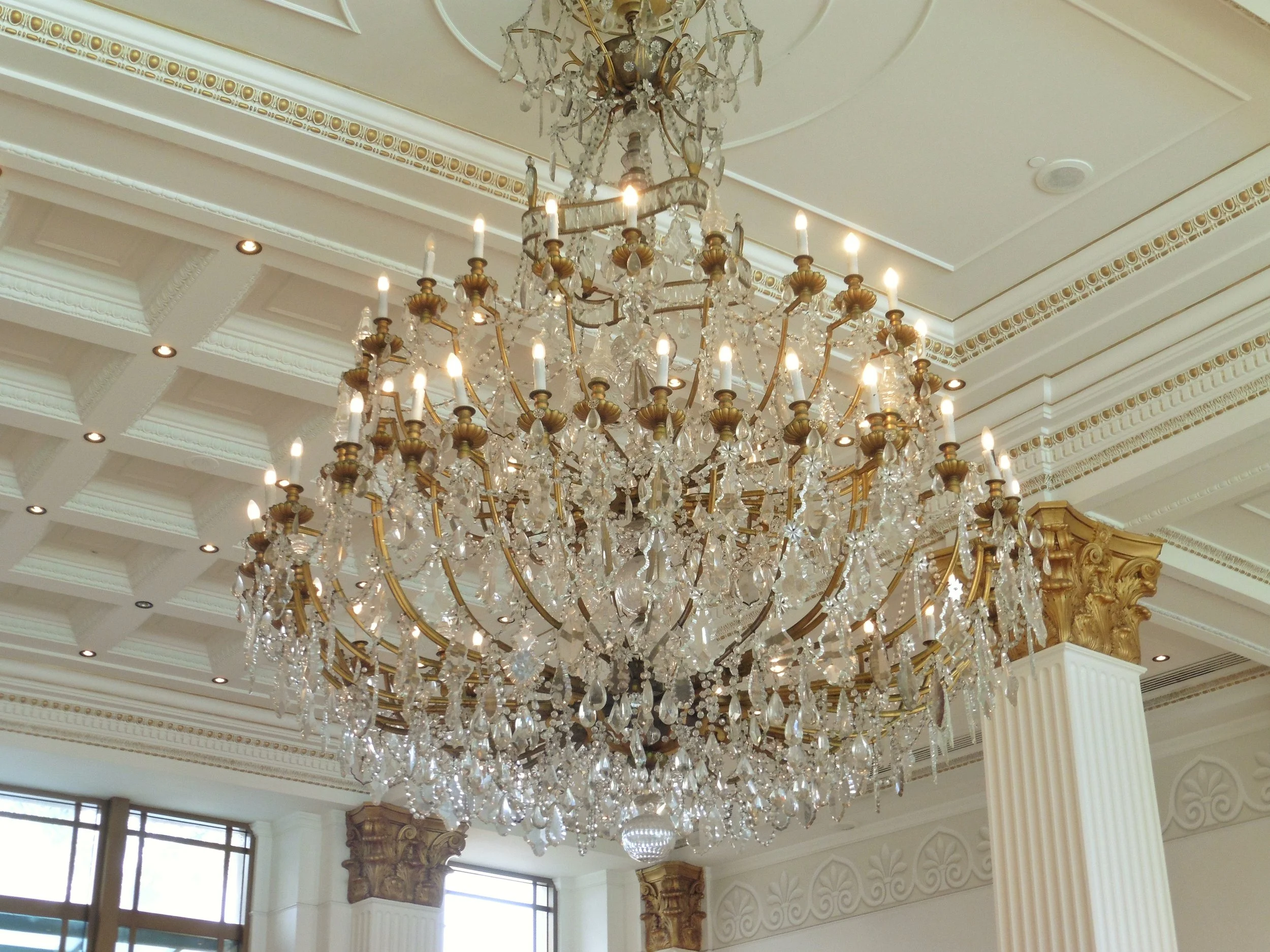 Grand crystal chandelier suspended above the hotel’s luxurious lobby at Imperial Hotel Gold Coast