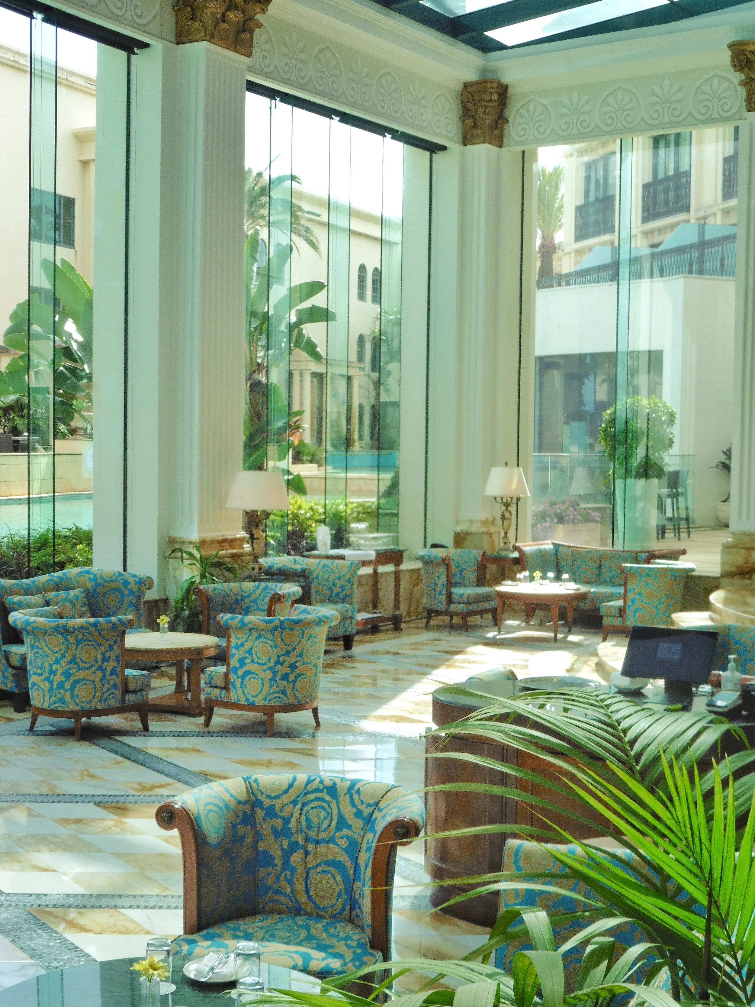 Sophisticated atrium lounge with floor-to-ceiling windows and pool views at Imperial Hotel Gold Coast