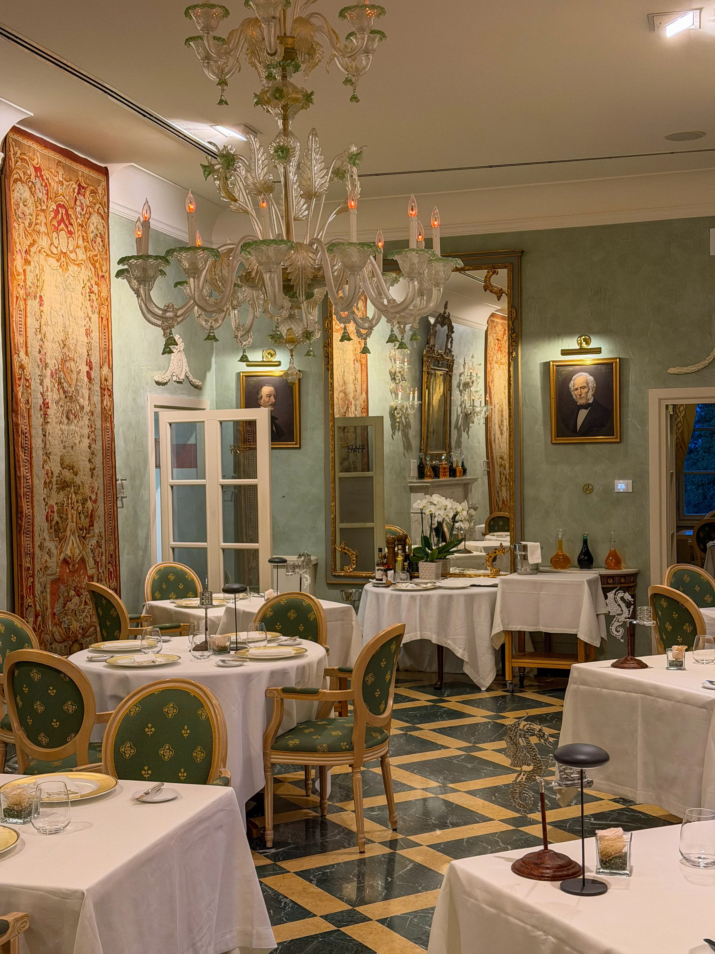 Refined fine dining restaurant with Murano chandeliers and timeless elegance