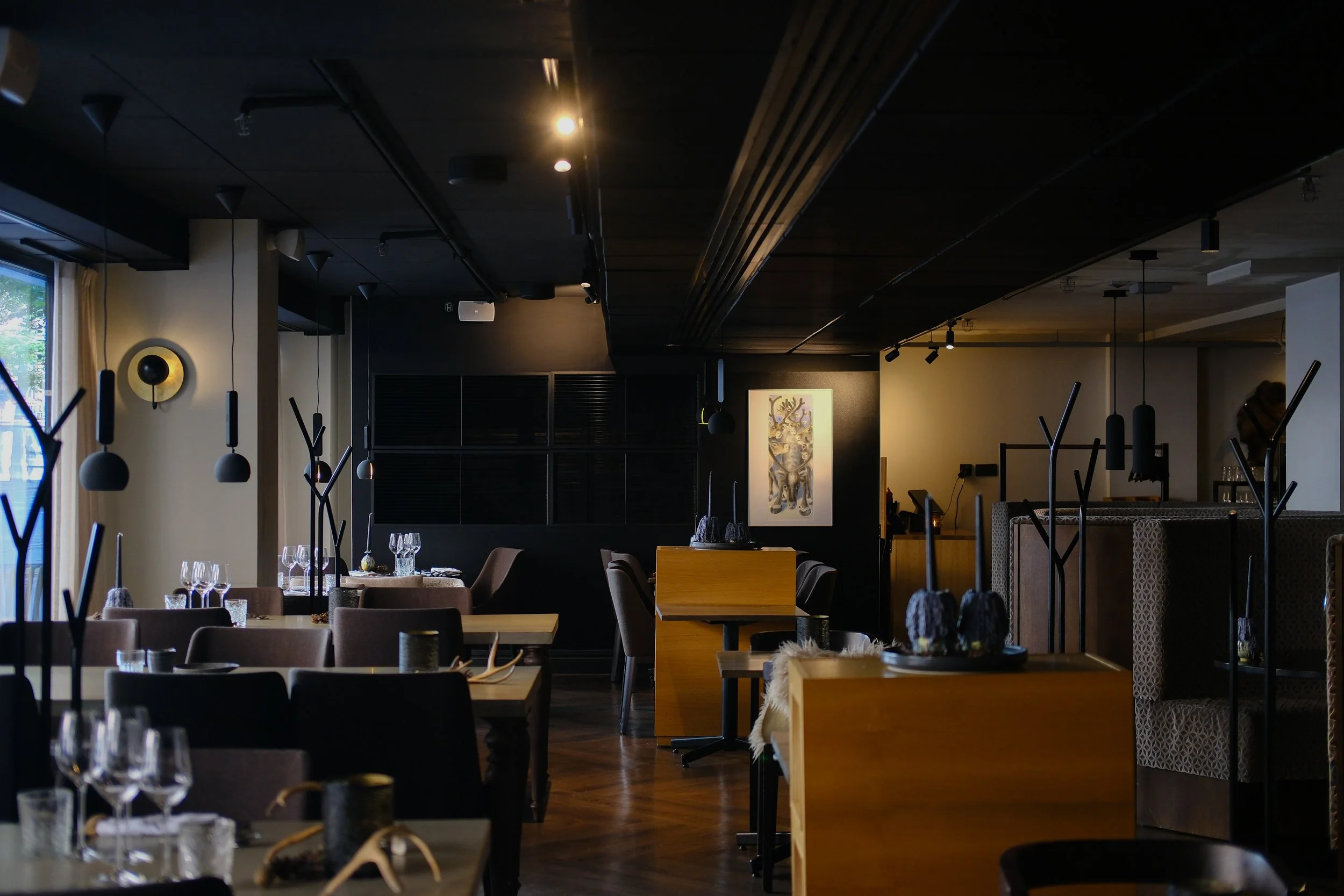 Elegant restaurant blending Scandinavian design with warm lighting