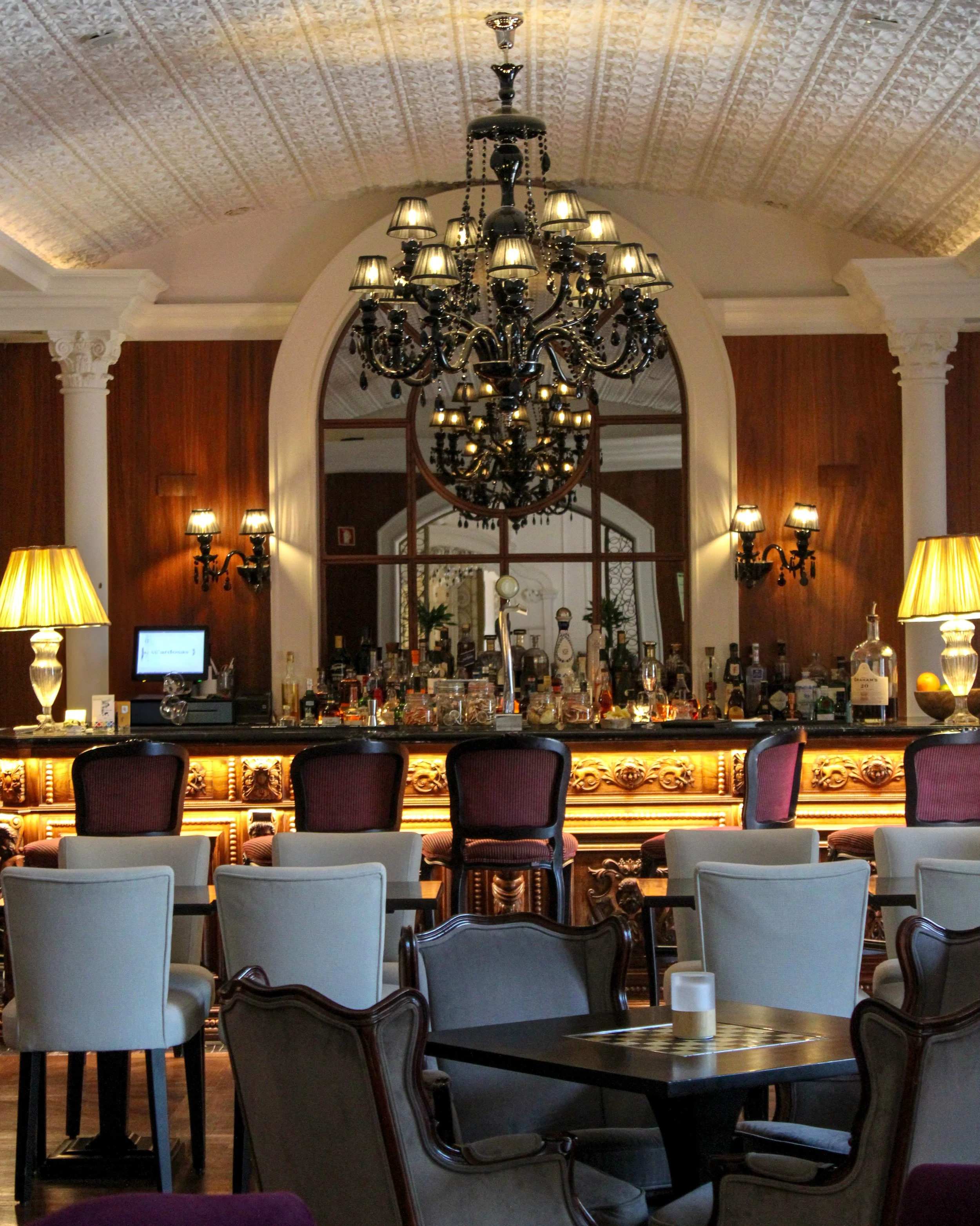 Sophisticated hotel bar featuring crystal chandeliers and elegant interiors