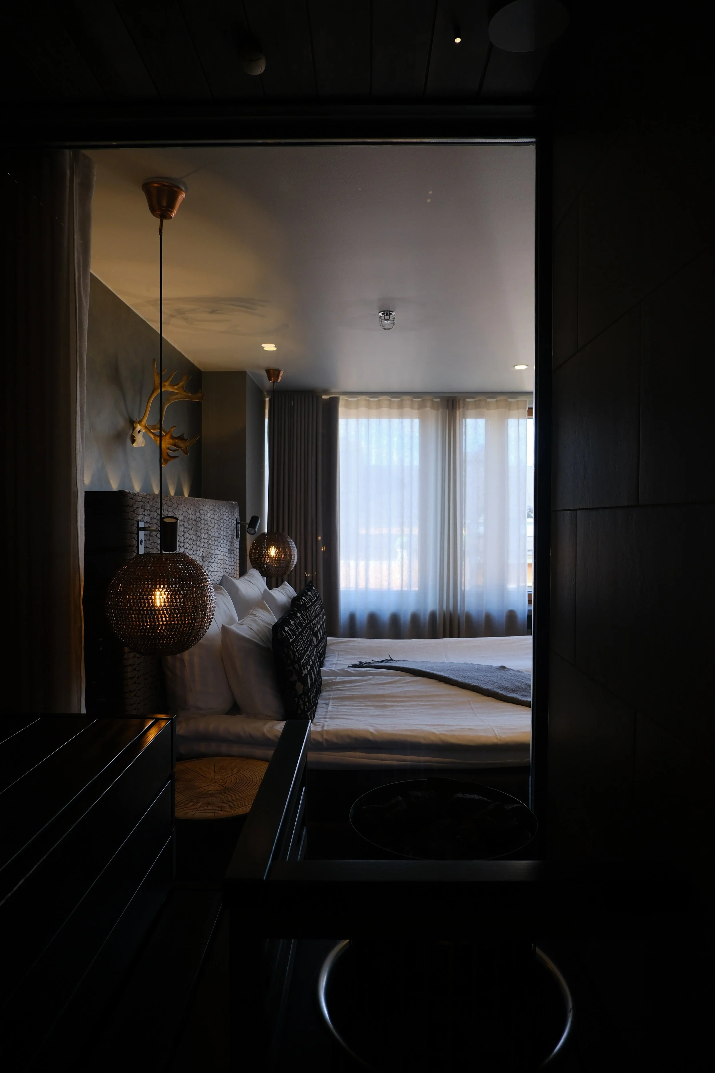 Private in-room sauna connected to a stylish Nordic bedroom