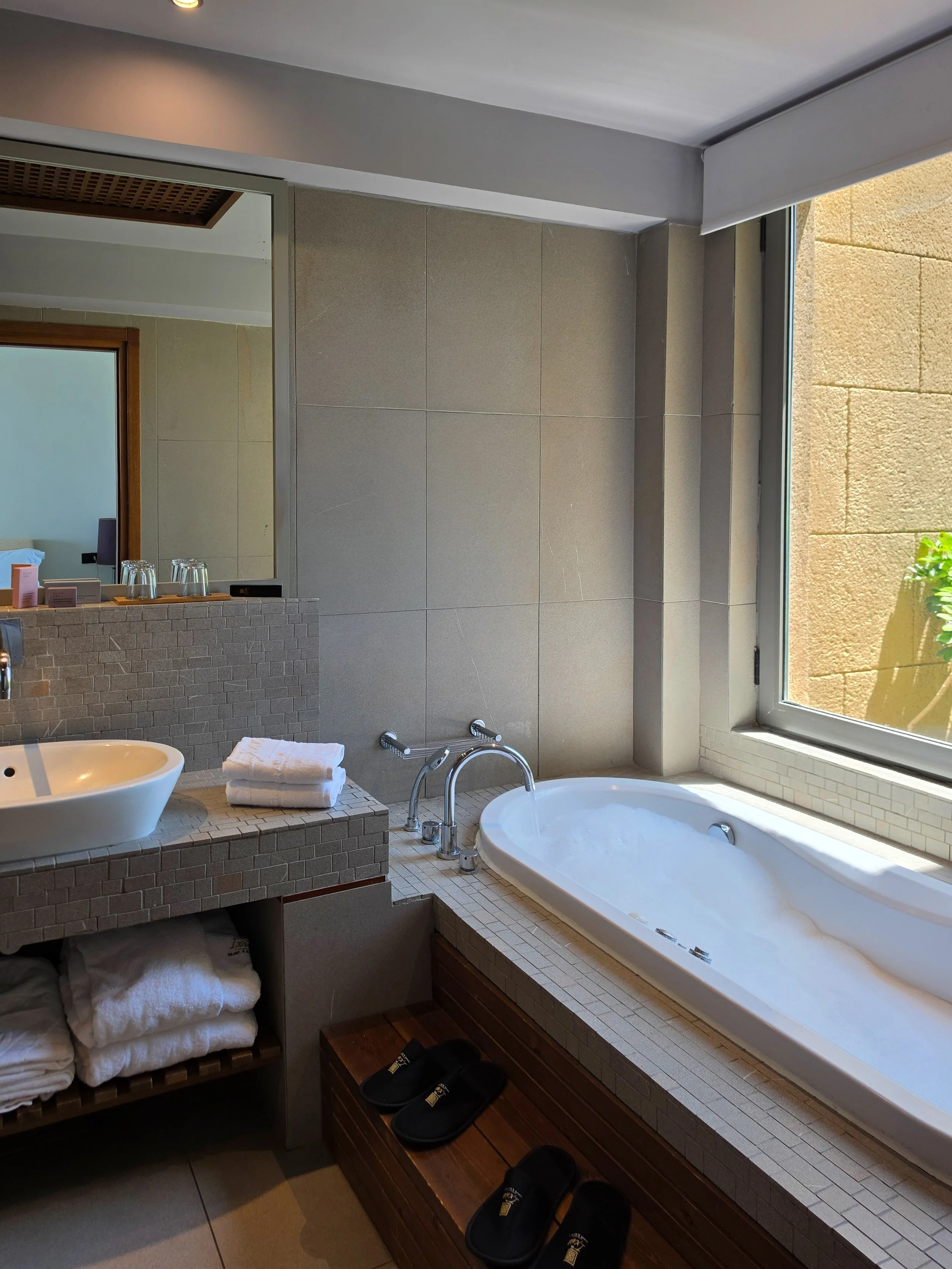Modern bathroom featuring a relaxing soaking bathtub and elegant finishes