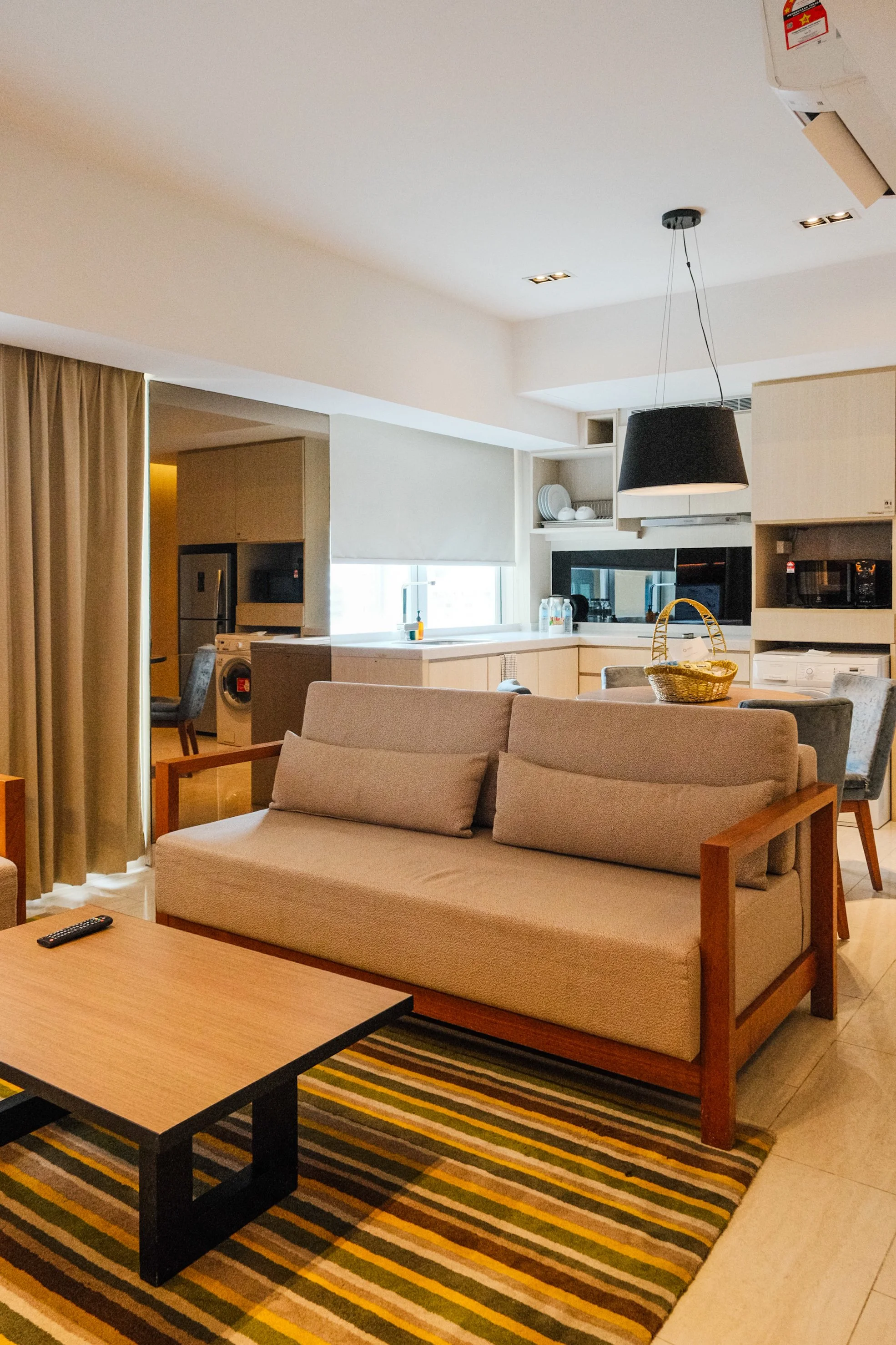 Spacious suite with living area, dining space, and fully equipped kitchen