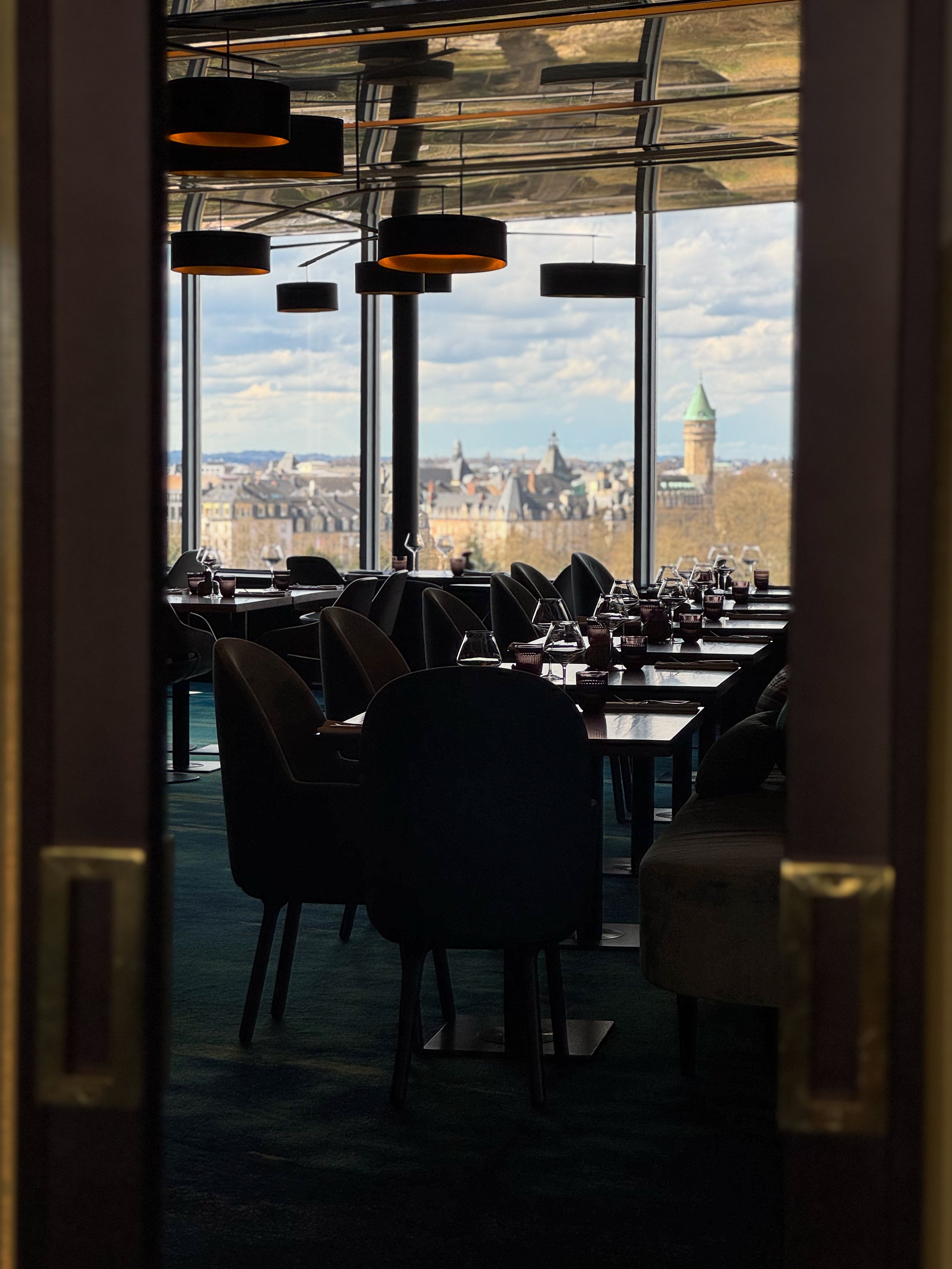Refined restaurant with panoramic city views and contemporary French-inspired dining at Sofitel Le Grand Ducal