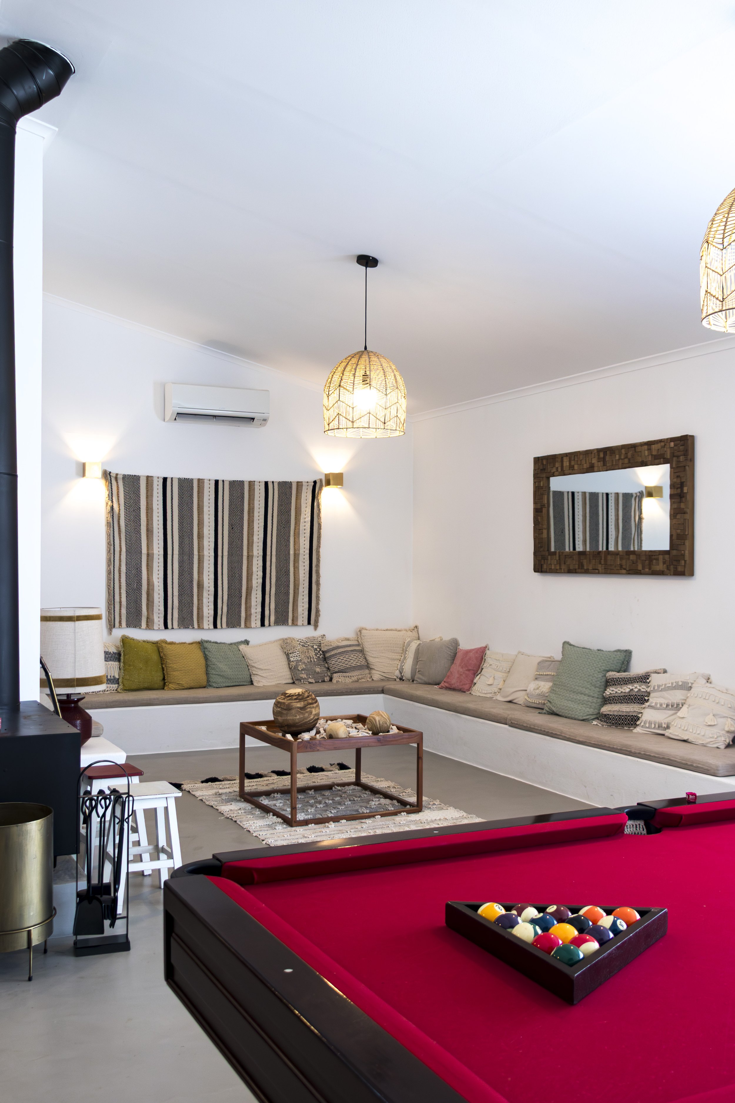 Comfortable games lounge featuring a billiards table, fireplace, and inviting communal seating