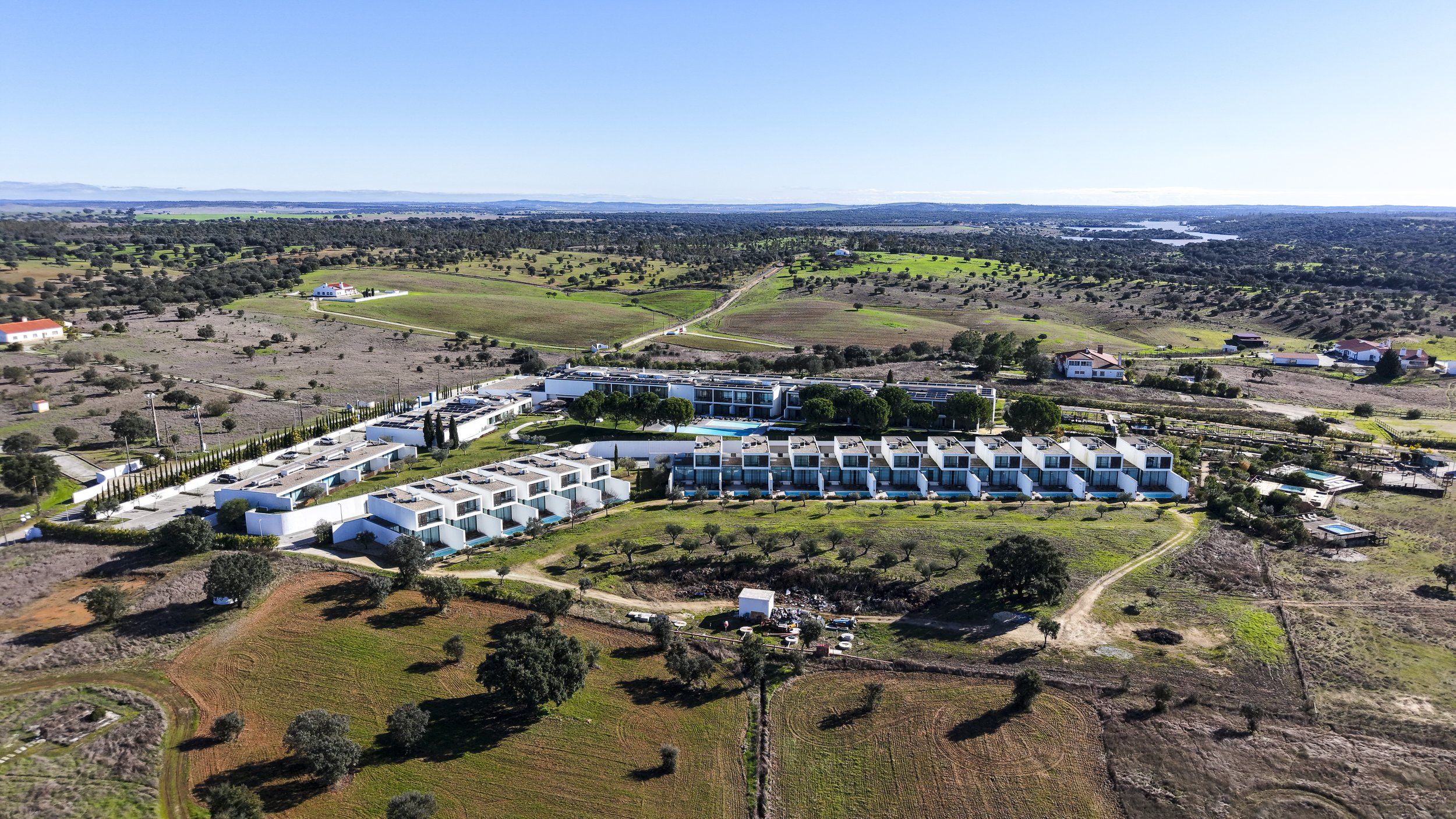 Panoramic aerial view of Octant Évora surrounded by the rolling landscapes of Alentejo