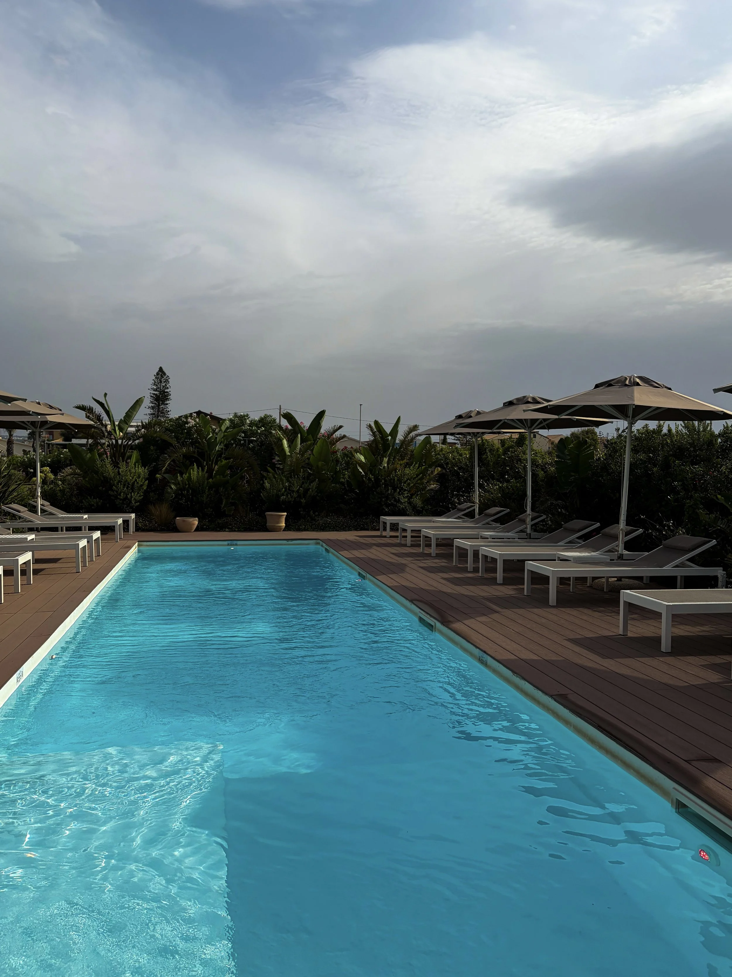 Serene outdoor swimming pool perfect for unwinding beneath the Sicilian sky