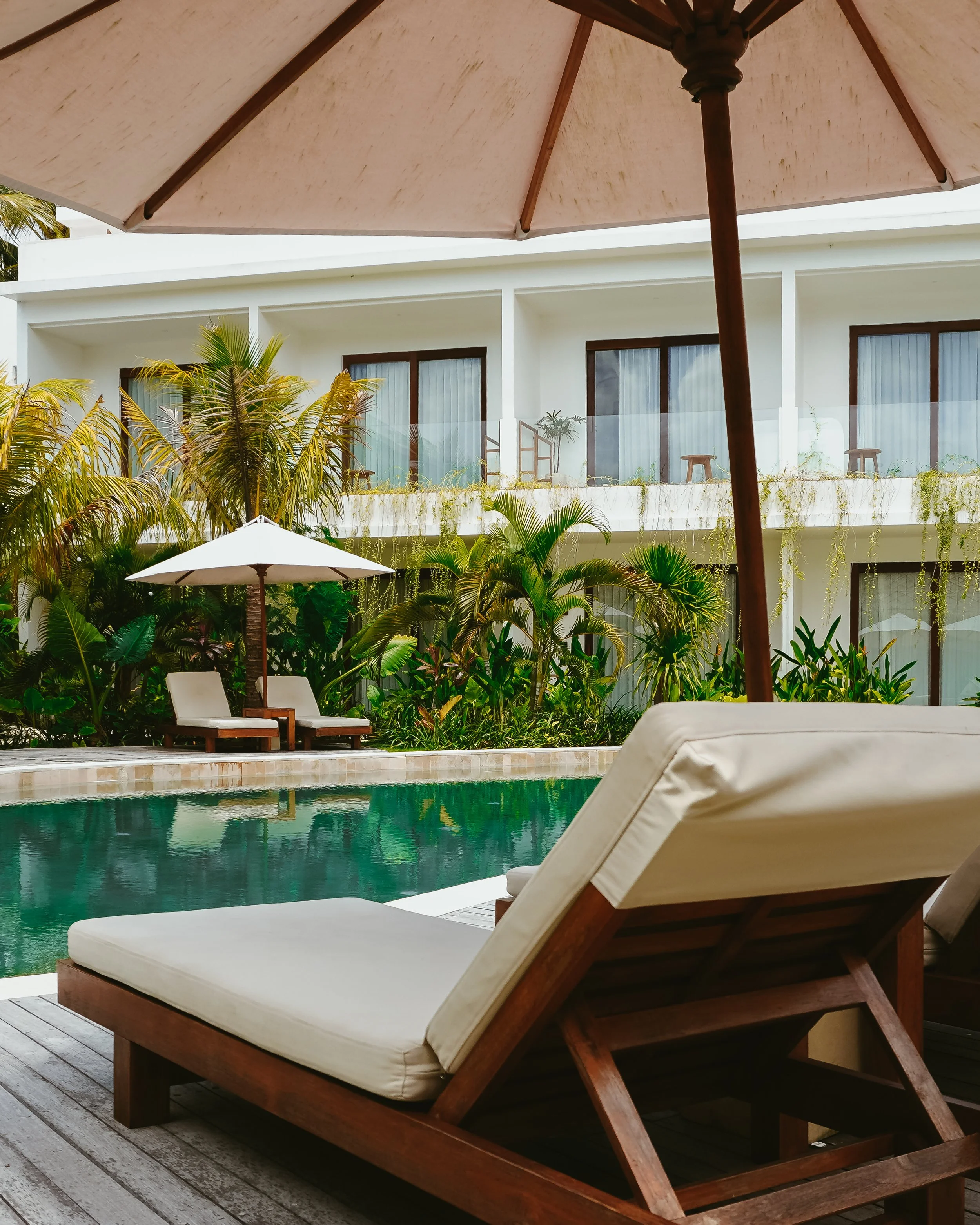 Slow afternoons by the pool, surrounded by palms and soft light, designed for complete stillness, Uryah Hotel Lombok – Lombok, Indonesia.