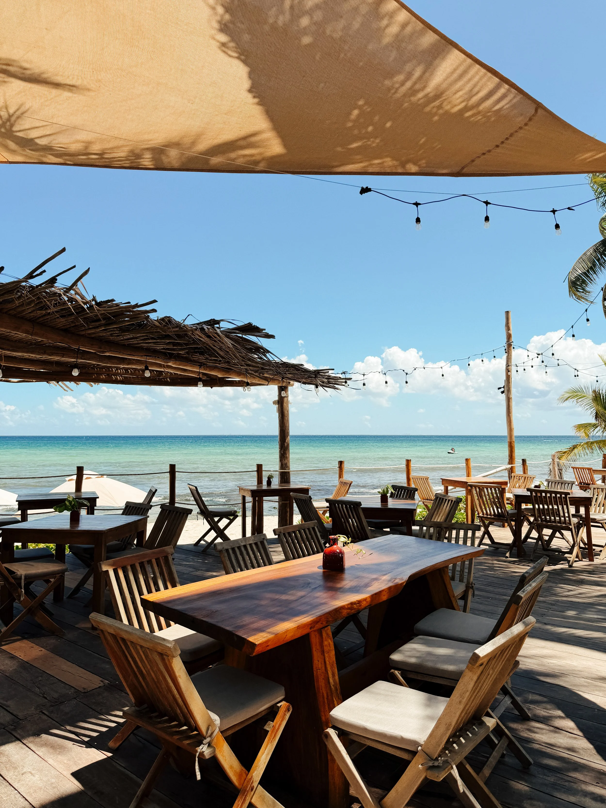 Open-air beachfront restaurant with panoramic Caribbean views