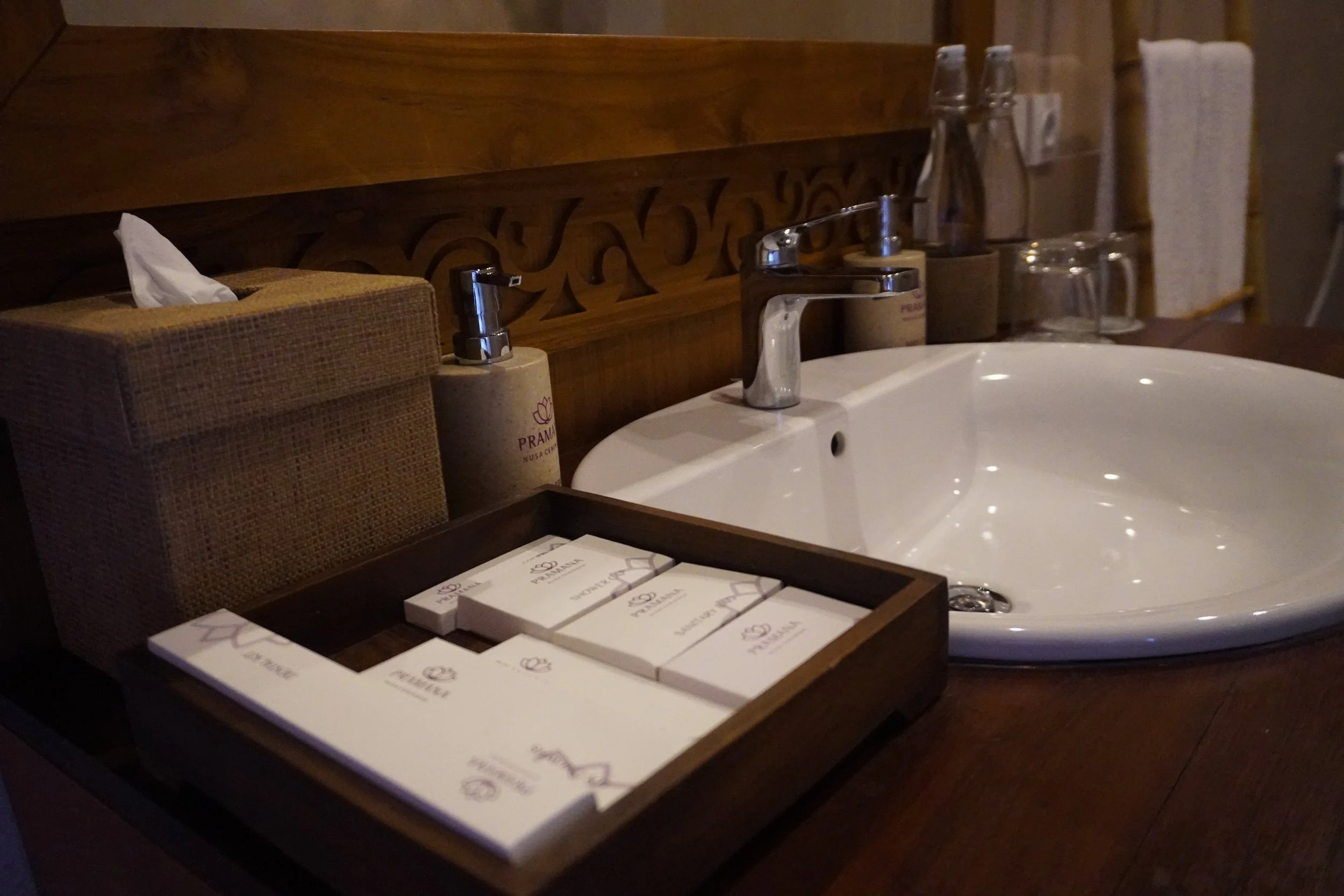 Boutique bathroom amenities arranged with natural materials and wooden finishes
