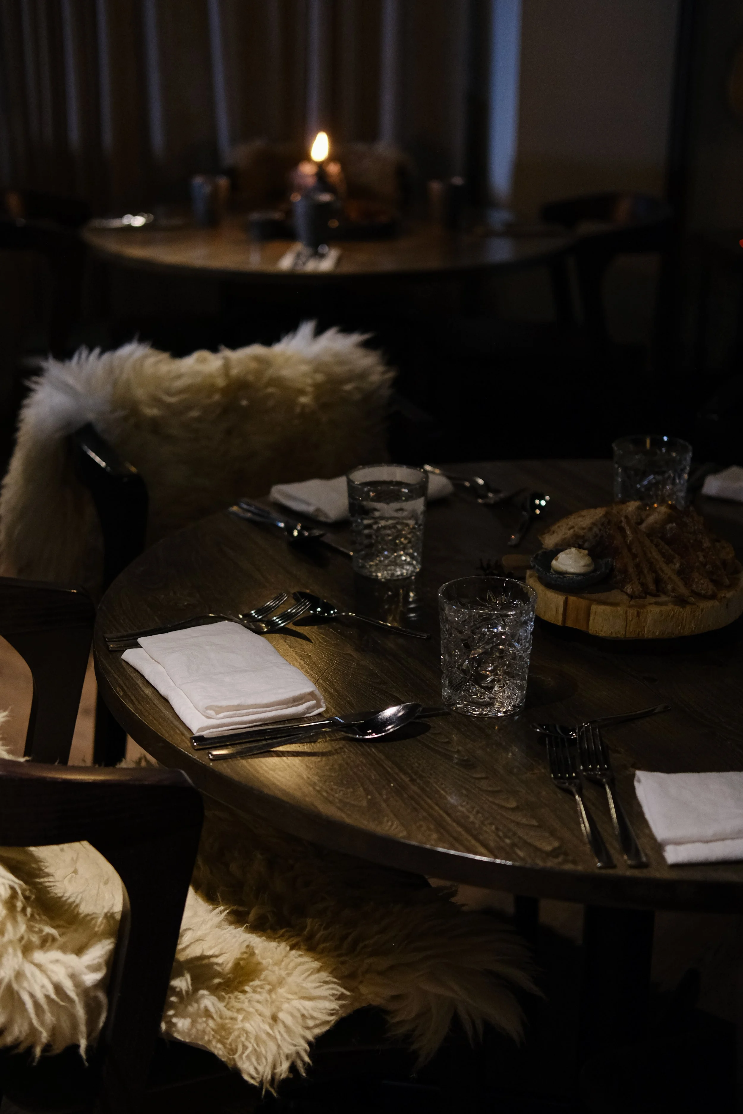 Warm candlelit restaurant showcasing elegant Nordic dining atmosphere