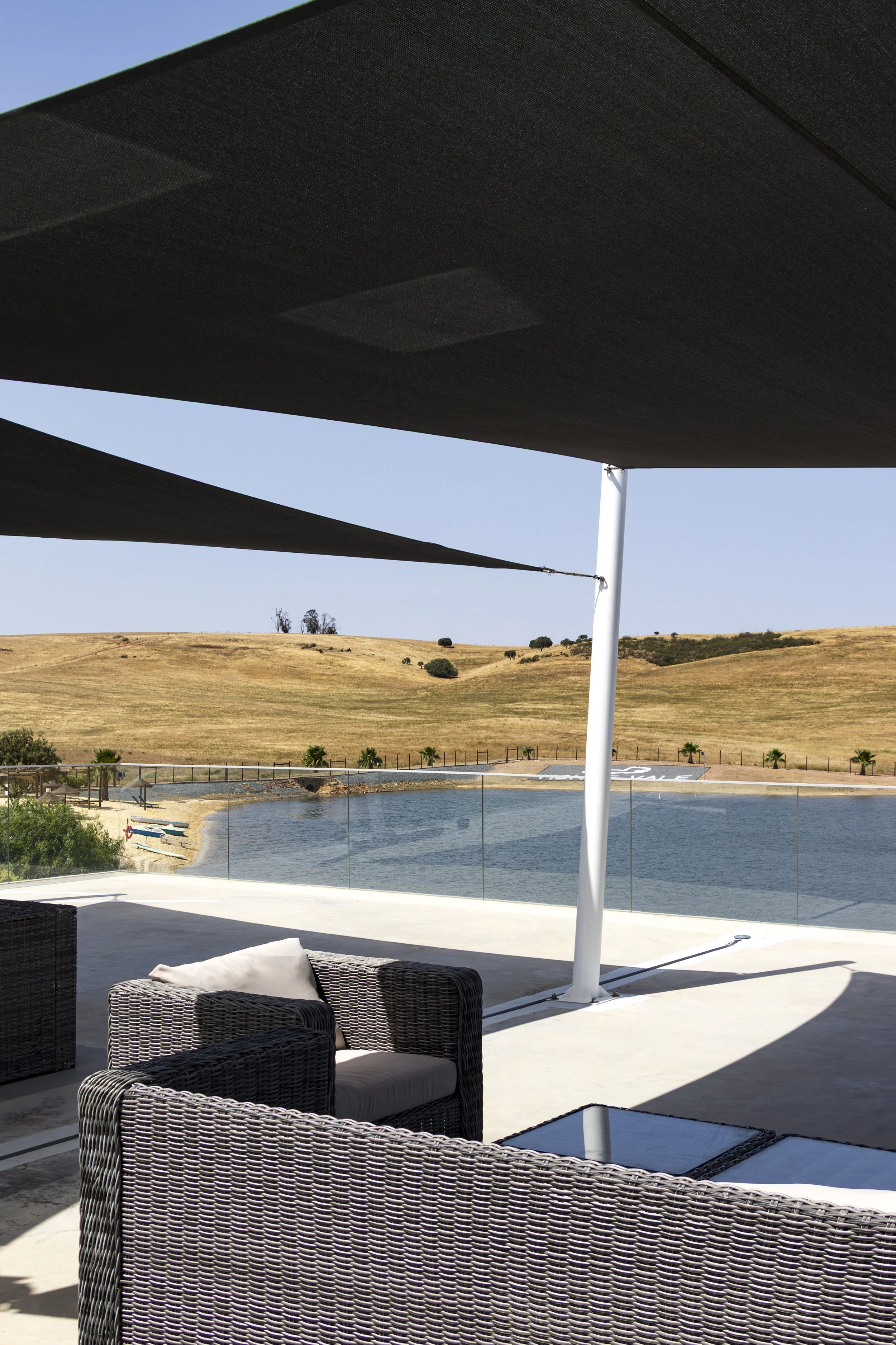 Shaded panoramic terrace overlooking the lake and rolling countryside landscapes