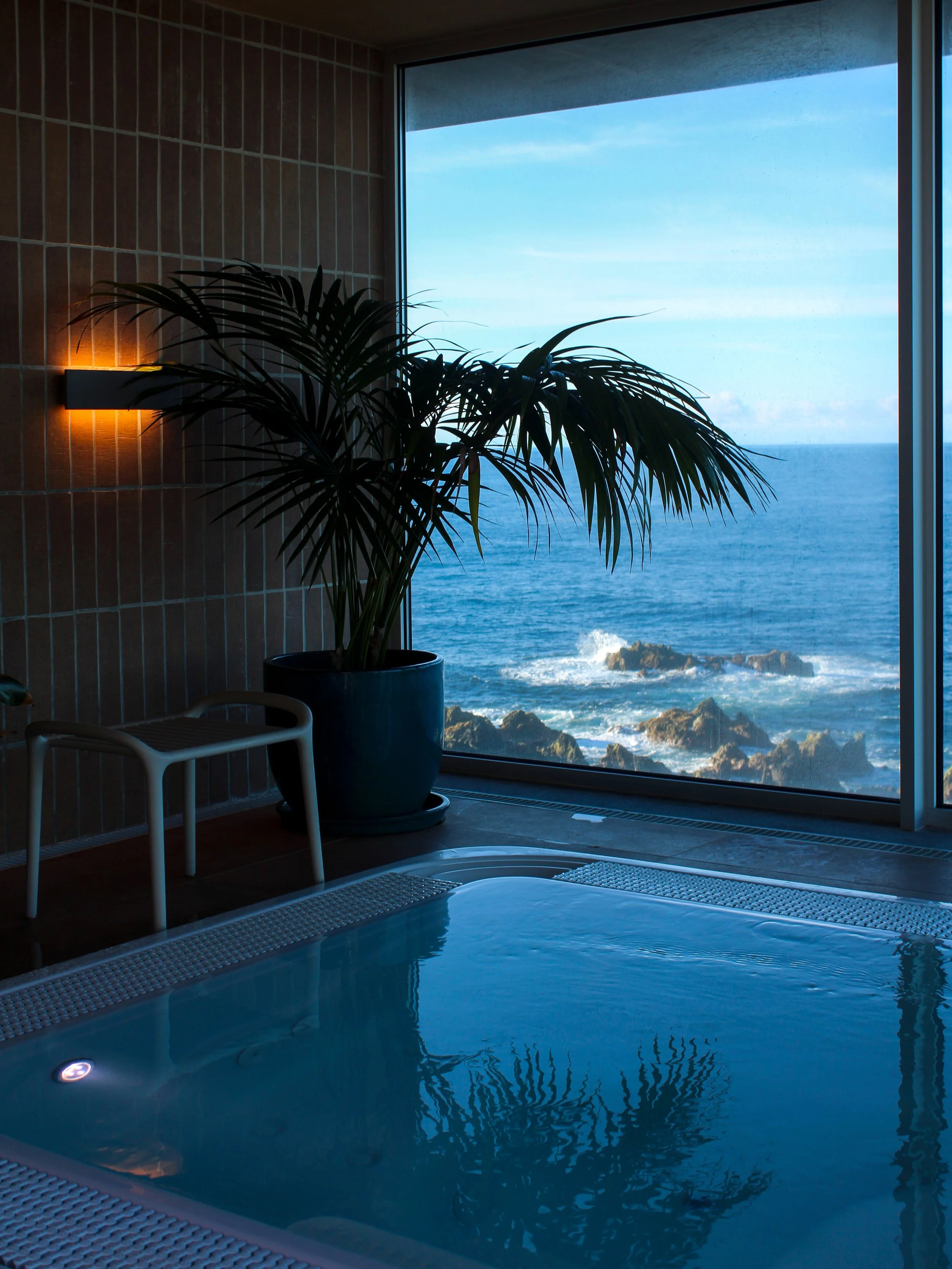 Indoor spa pool with ocean views creating a peaceful wellness experience beside the Atlantic