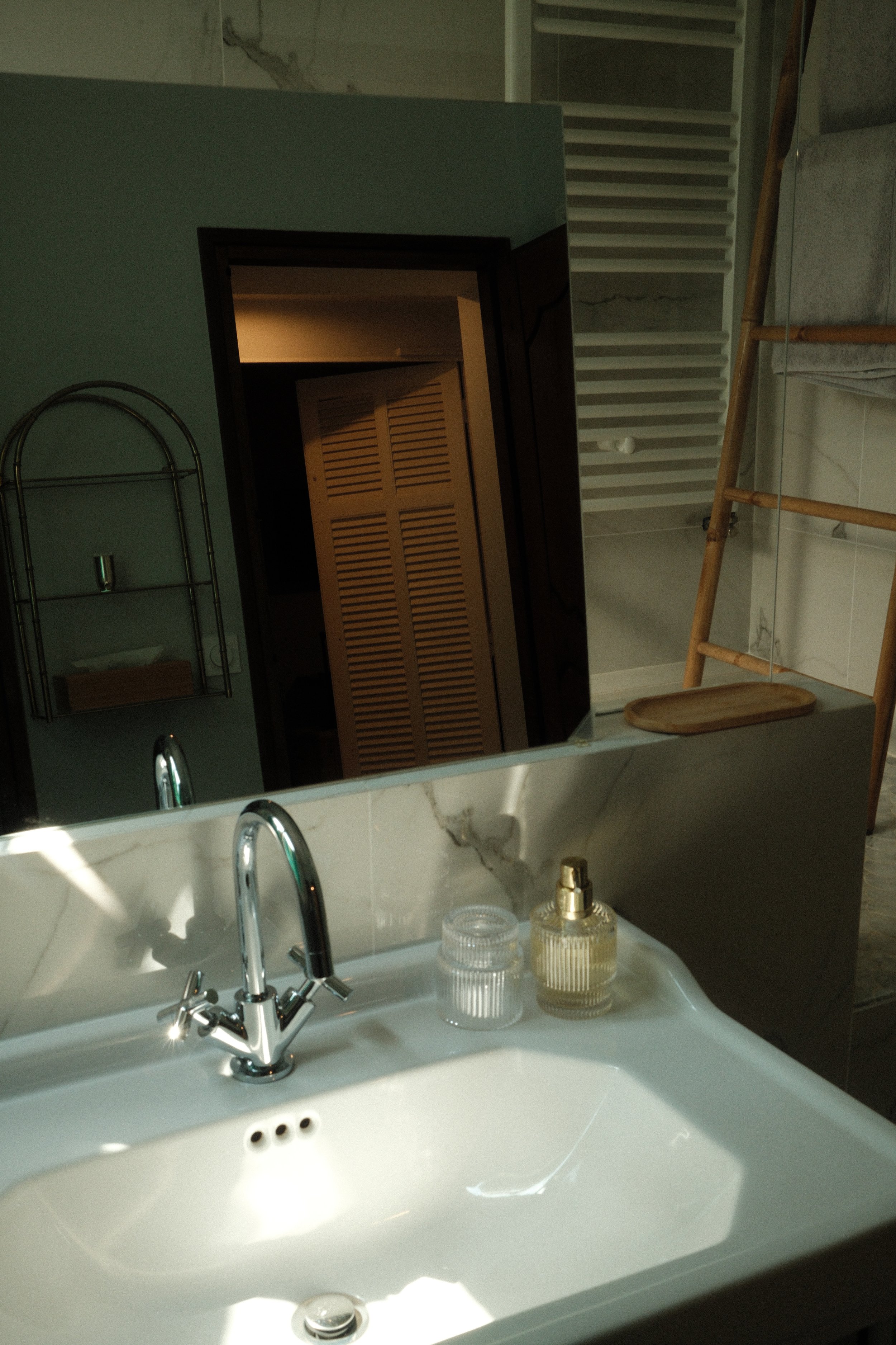 Minimalist bathroom with warm natural light and refined details