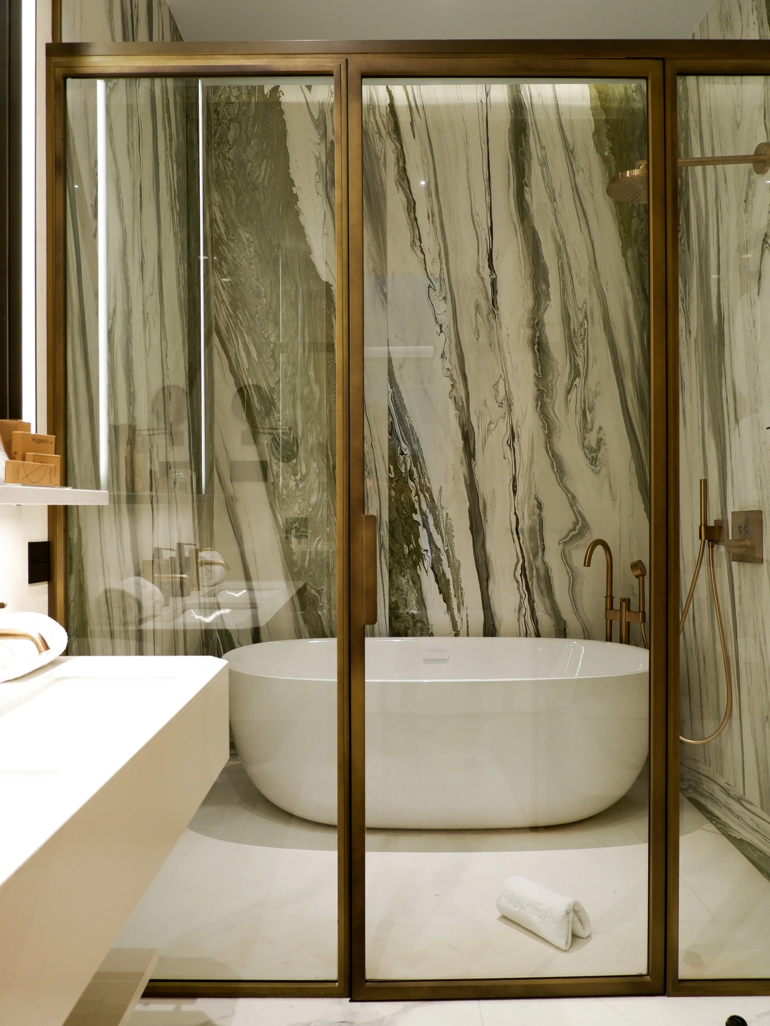 Marble bathroom with freestanding bathtub and rainfall shower