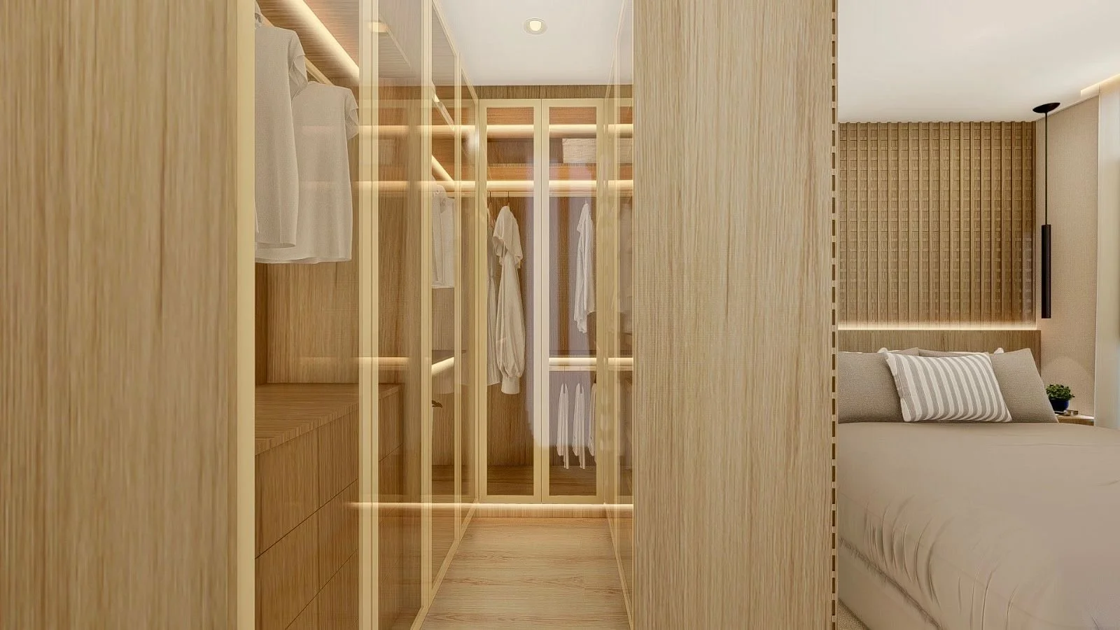 Vista interna della cabina armadio passante con ante vetrate, scaffalature illuminate e collegamento diretto alla zona notte. Il progetto sfrutta il guardaroba come elemento di transizione tra gli ambienti.