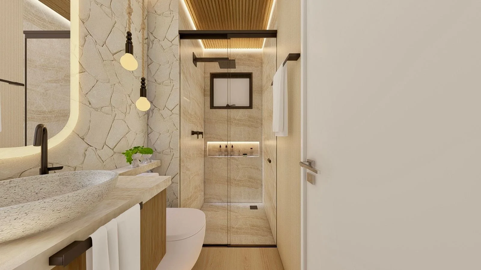 Bagno moderno con doccia in vetro, rivestimento effetto pietra, lavabo da appoggio e rubinetteria nera.