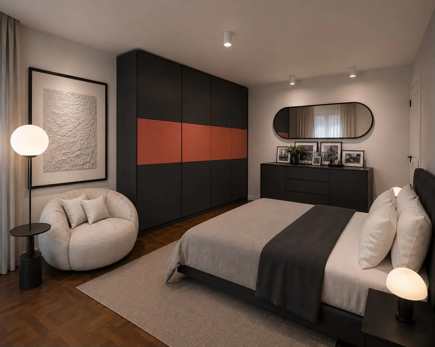 La vista generale mostra il dialogo tra il letto imbottito, la poltrona dalle forme avvolgenti e l’armadio a tutta altezza. La fascia color rosso mattone rompe la continuità del nero diventando il segno distintivo della composizione.