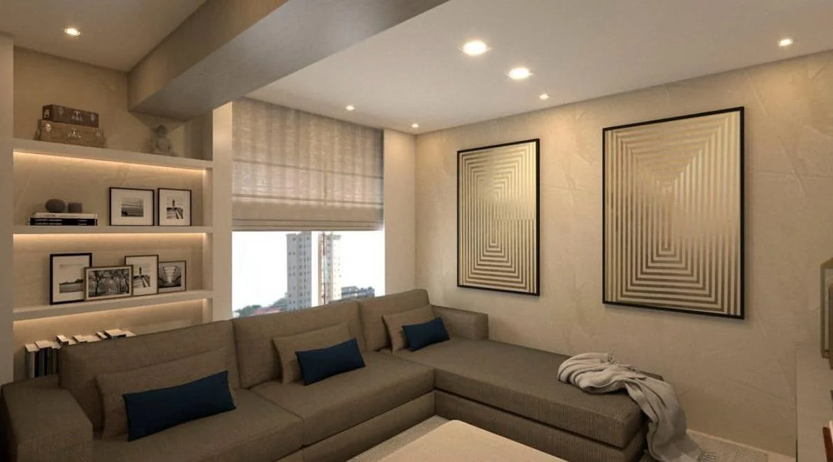 Zona living con arredi su misura, palette neutra e illuminazione integrata per un’atmosfera calda ed elegante.