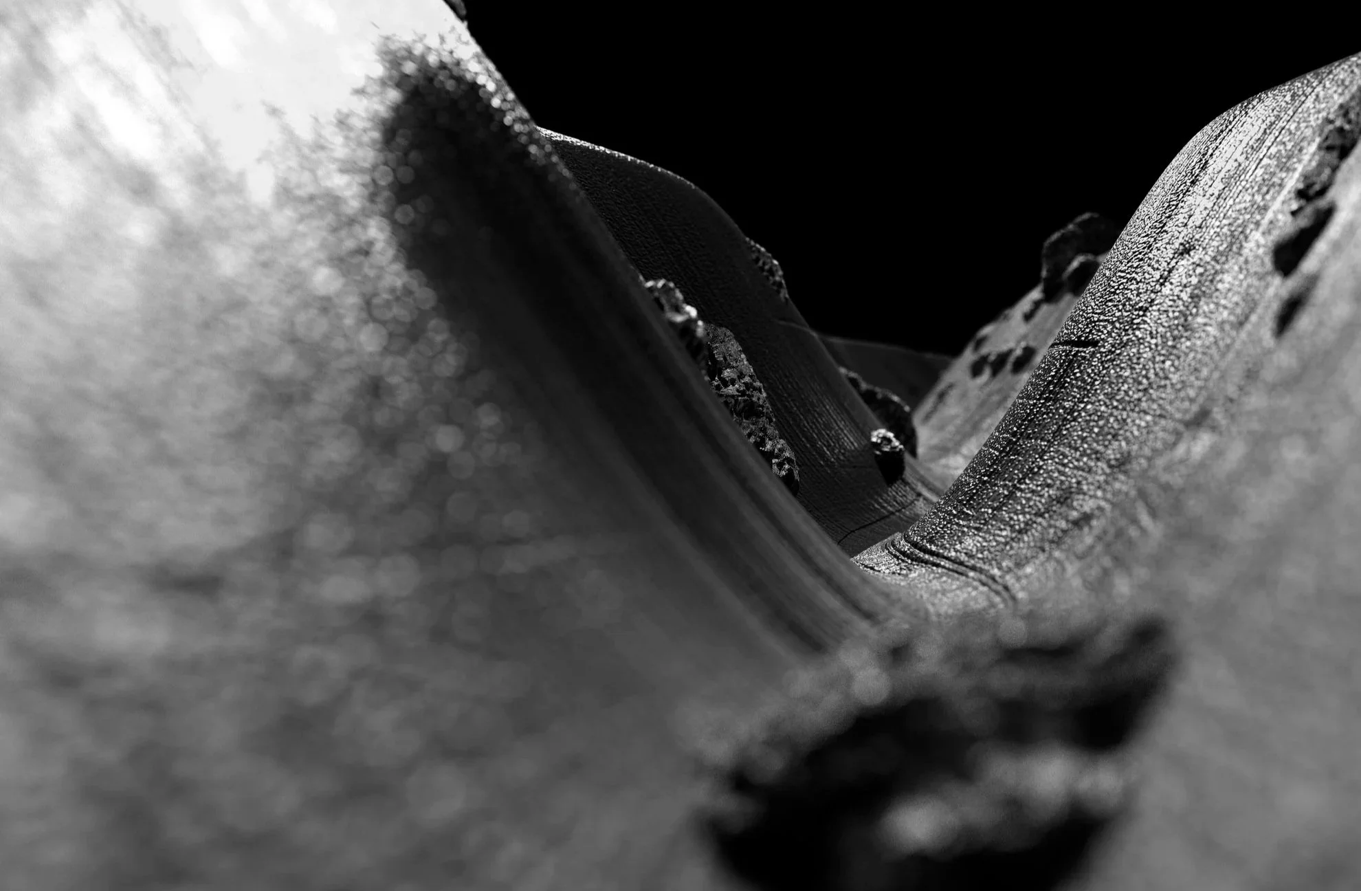 Abstract digital rendering of a vinyl record groove at microscopic scale, transforming sound into a visual landscape.