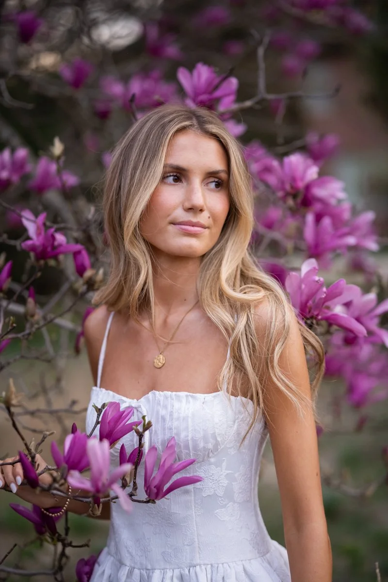 portrait of a beautiful teen in a magnolia