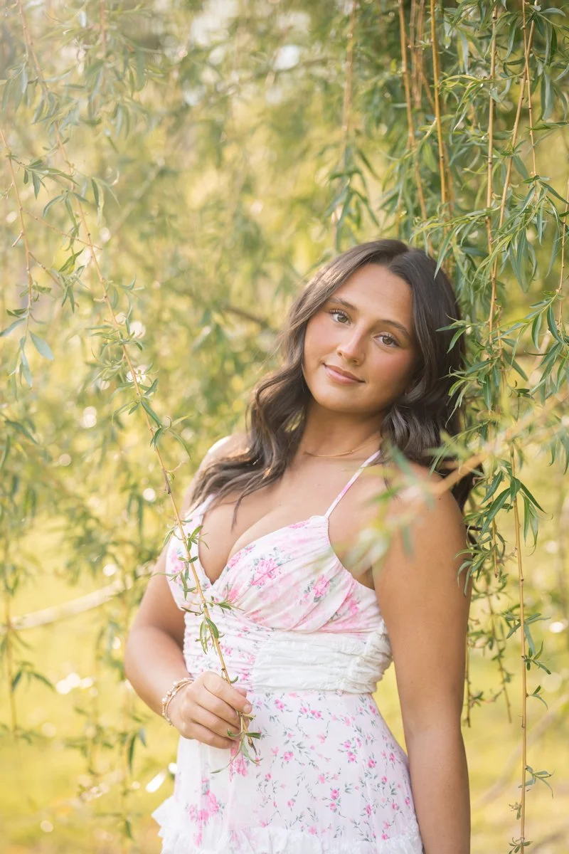 a portrait captured by a weeping willow tree