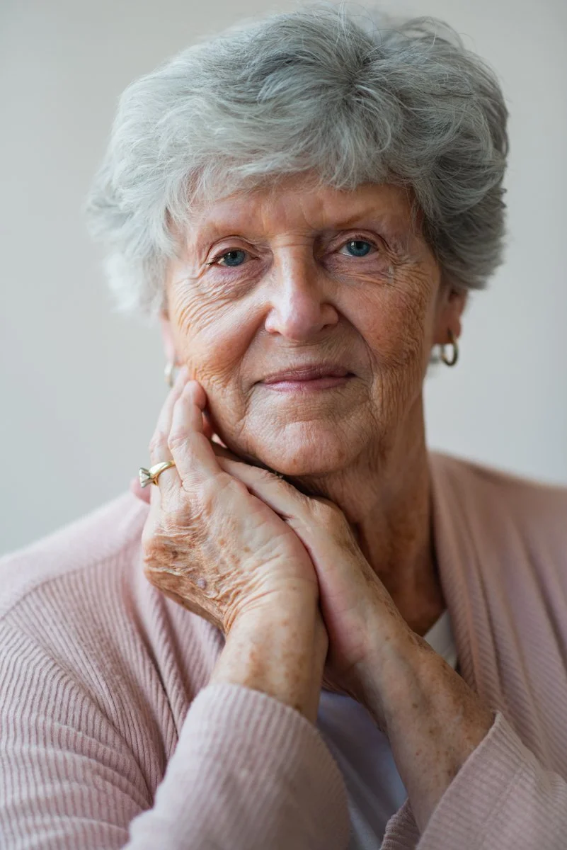 woman with gray hair posing for a portrait