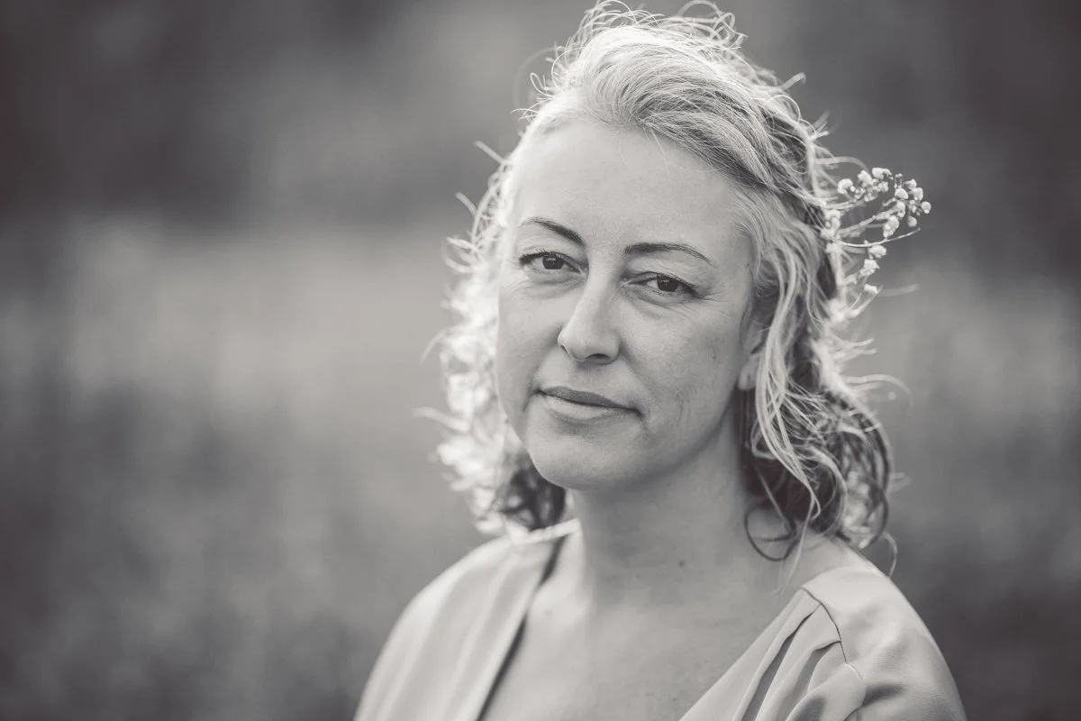 a portrait of a woman in black and white with flowers in her hair in Chicago