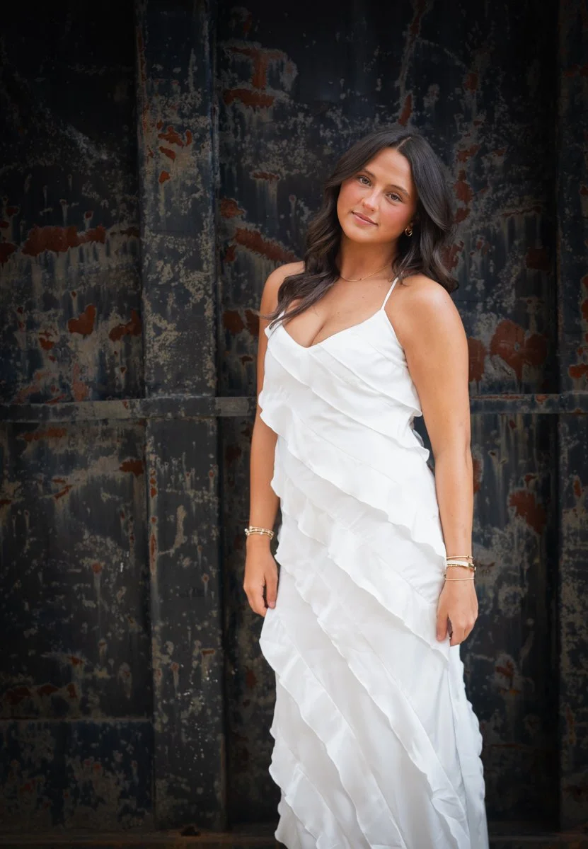 senior portrait of a girl in a white dress