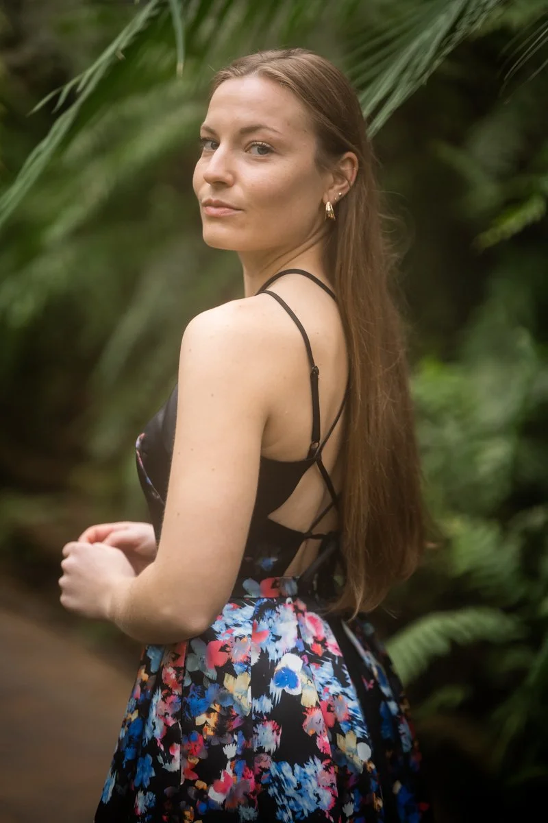 Portrait of a woman in a conservatory