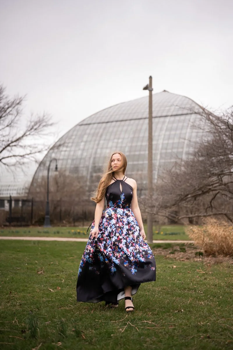 beautiful woman walking through a garden