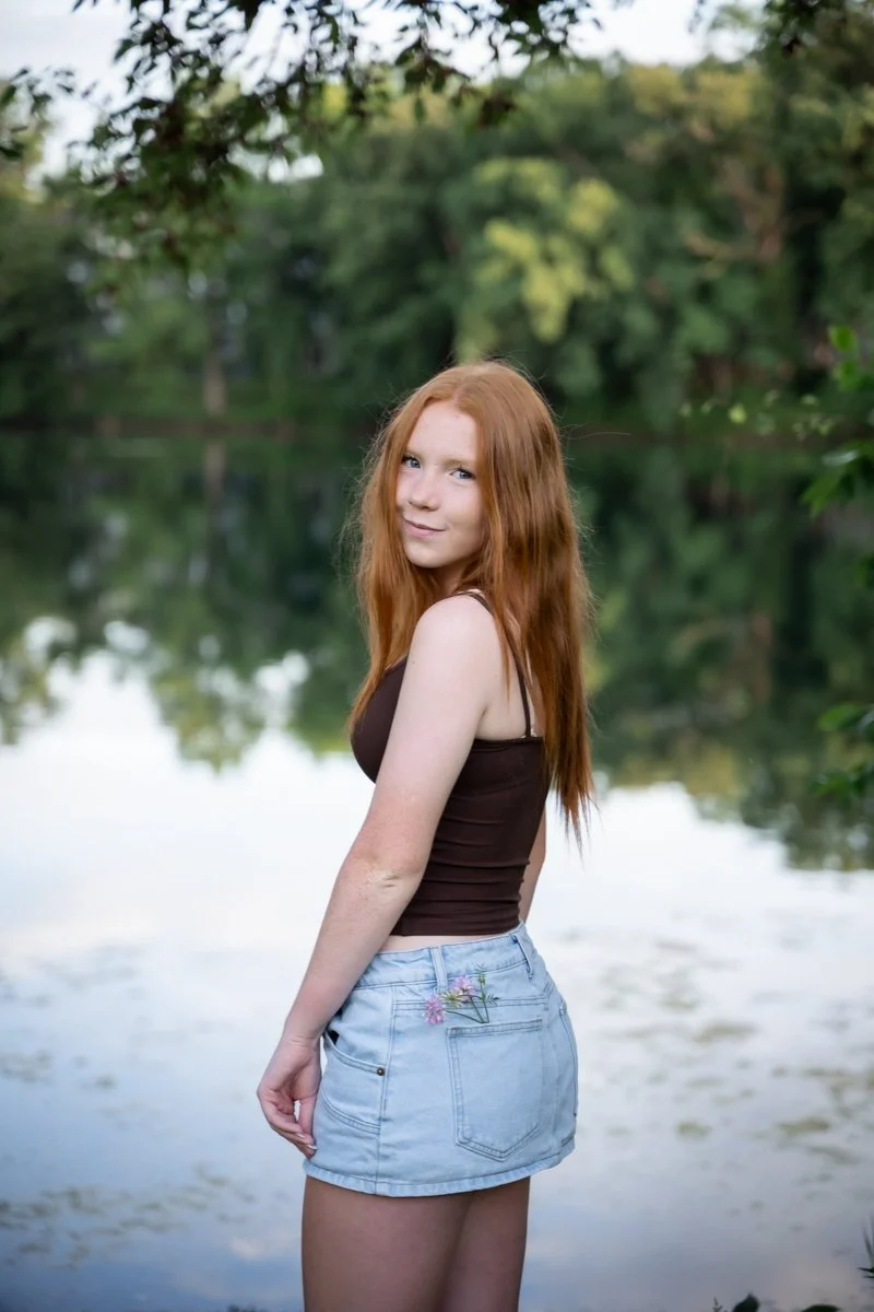 portrait of a teen by a photographer by a lake in Downers Grove Illinois