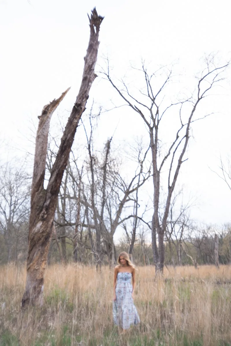 lifestyle shot of a woman in a dress in a field in Chicago