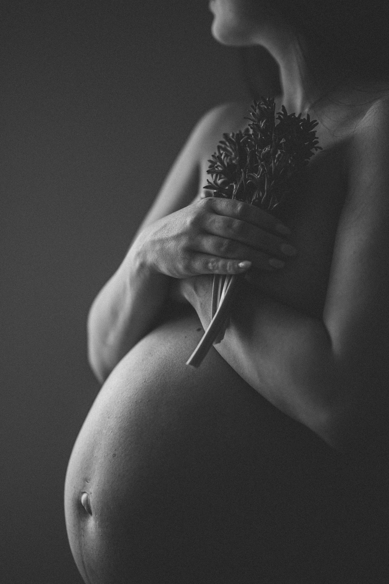 special moment baby bump captured in soft light.